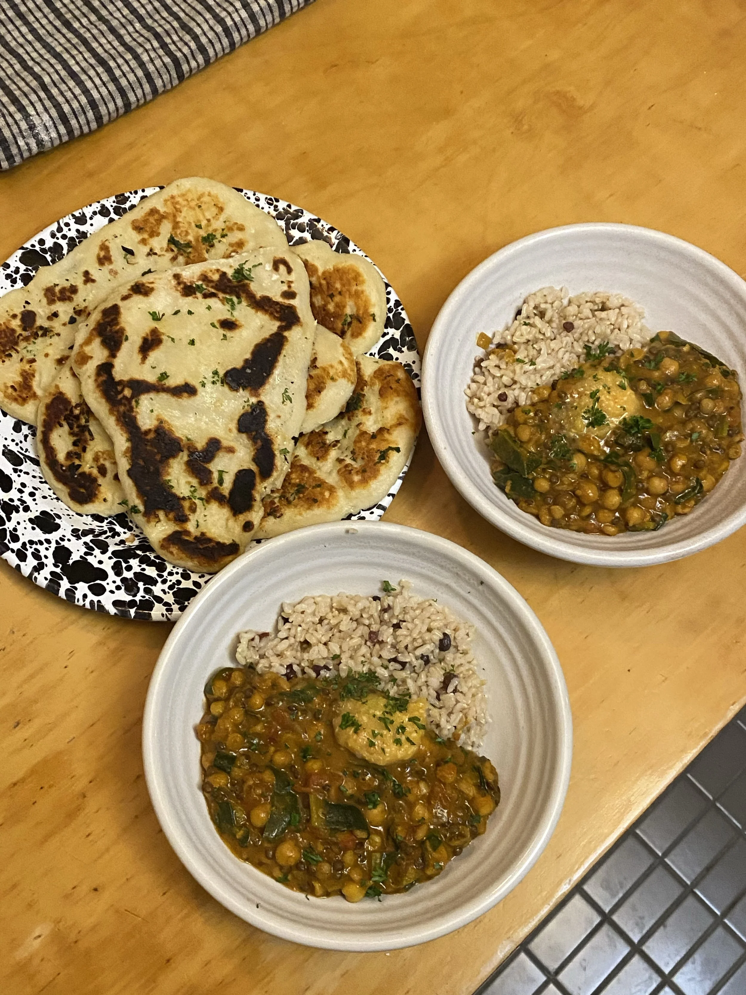 Chickpea, black lentil and split pea curry with chopped spinach from Mum & Dad’s garden. I added raisins to the brown rice to add a sweetness. Served with yoghurt garlic and herb flat bread.