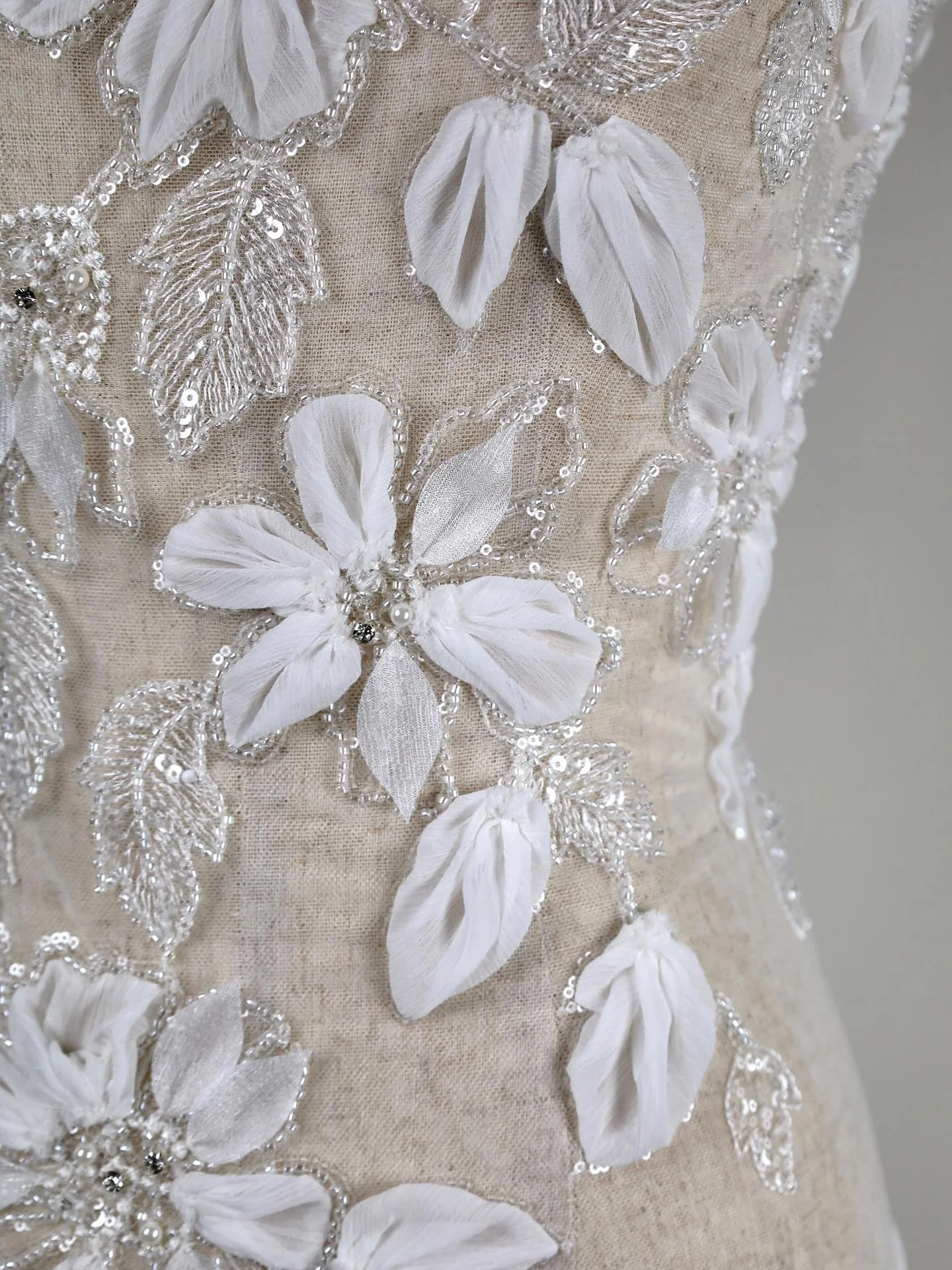 New Product
F7064B &middot; 3D Embroidered Lace &middot; Lt Ivory &middot; 140cm Width

A couture lace featuring sculptural 3D flowers with pearl and diamante bead centres, highlighted by delicate sequins for subtle luminosity. The dimensional embroi