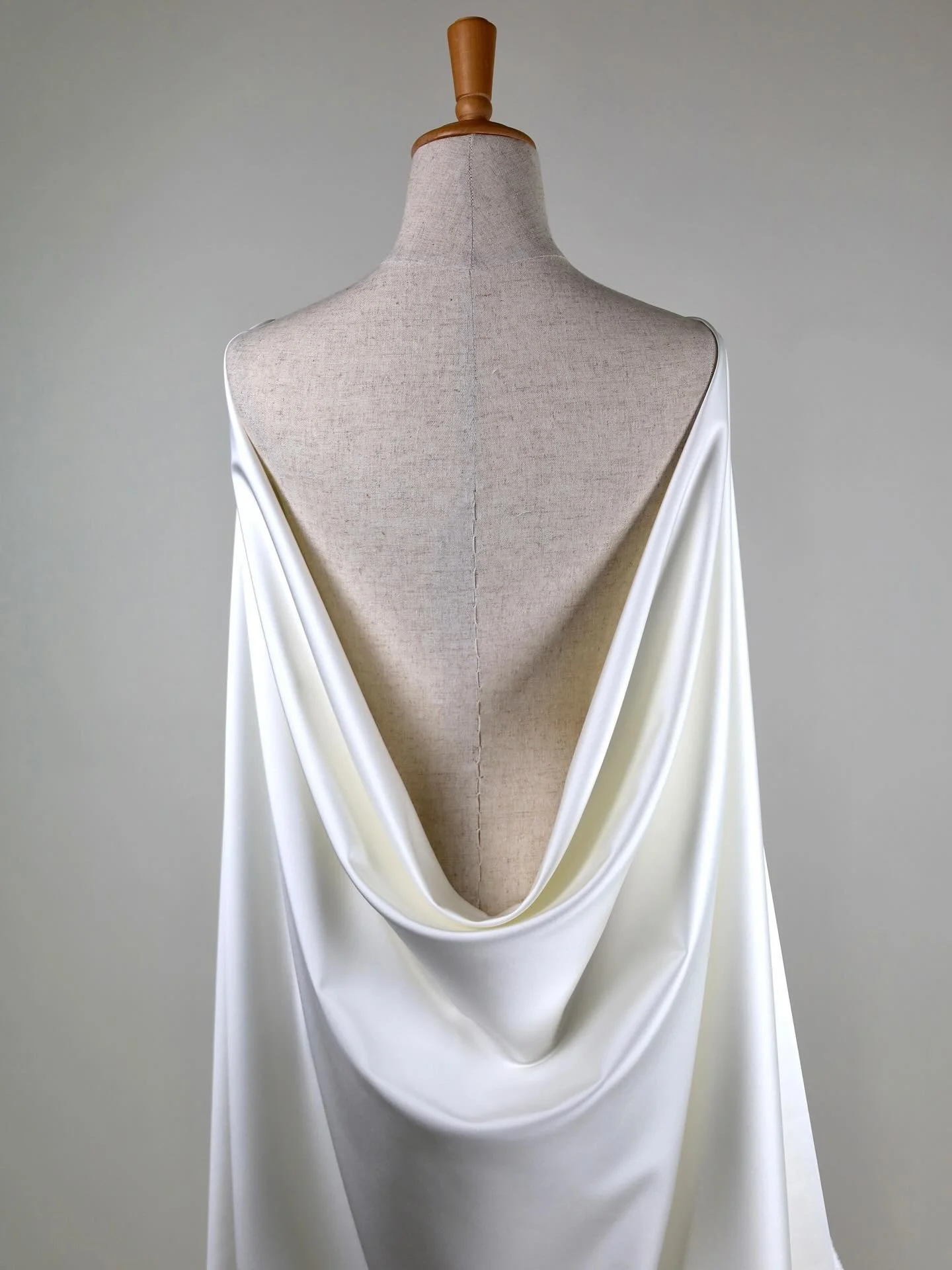 SUPREME Stretch Satin &ndash; Ivory

Our bestselling stretch satin &mdash; soft, luminous, and beautifully fluid. SUPREME offers a gentle drape and luxurious handfeel while maintaining body and structure.

Crafted from 100% polyester with a weight of