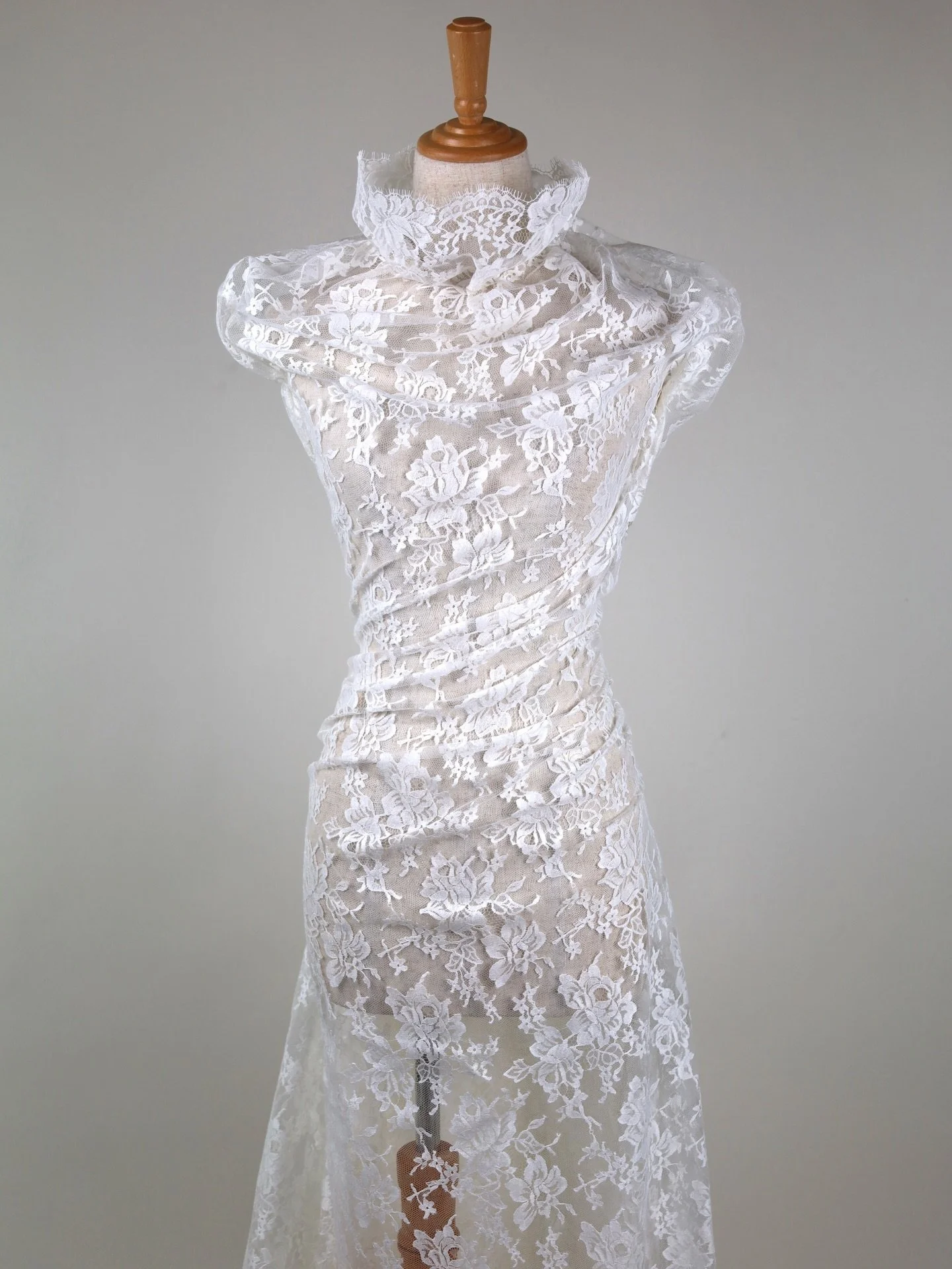 F4846.04 Chantilly Lace &middot; Ivory &middot; 135cm wide &middot; Made in France

A true French Chantilly lace with a classic floral layout and a fine, soft net ground. The motif is elegant and balanced, with beautiful negative space and a gentle, 