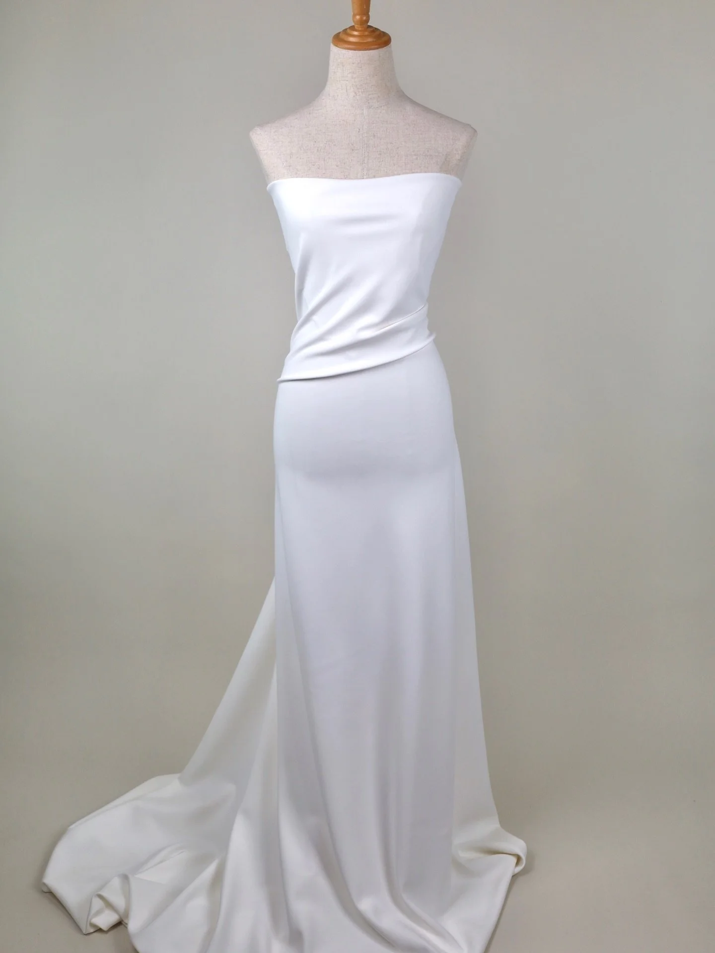 F8974 Stretch Crepe &middot; Ivory &middot; 145cm wide

A perennial favourite, always in demand. This modern bridal crepe has a smooth, matte finish and a beautiful fluid drape &mdash; skimming the body cleanly with a weighty, elegant fall. The added