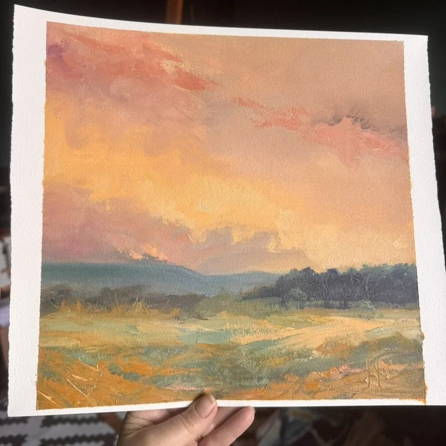 The Ageless Morning, original oil painting on paper by Helen Arthur: an apricot and rose sky over blue hills and golden fieldsimage.jpg