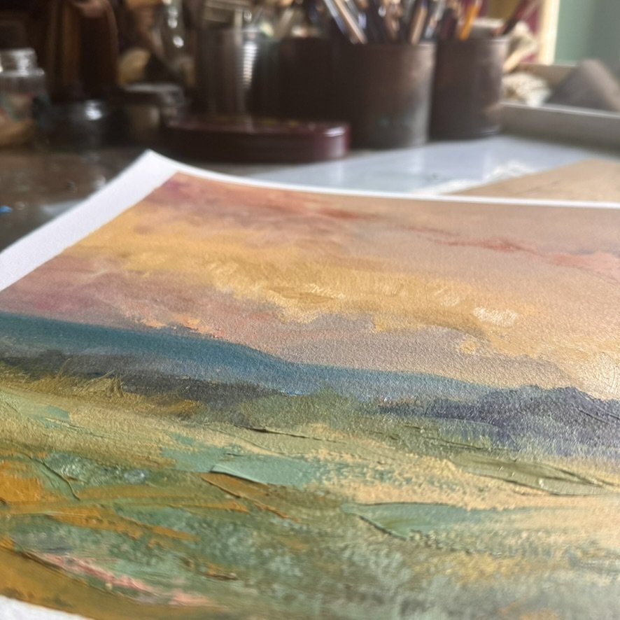 Close-up of The Ageless Morning by Helen Arthur, showing thick palette knife texture in sage and gold below soft blue hillsimage.jpg