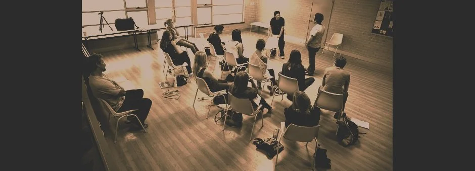 Class sitting and listening to a teacher