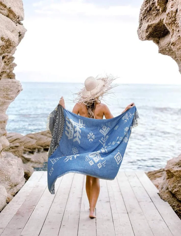 Woman in beach wear outside hat ocean