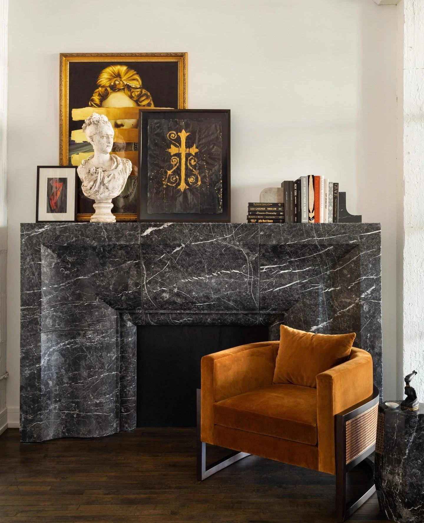 When the fireplace becomes the heart of the home 🔥⁠
⁠
Sculptural surrounds from our DMID Fireplace Collection with Material Bespoke Stone + Tile, layered with art and rich textures &mdash; designed to anchor the space all season long.⁠
⁠
Design by @