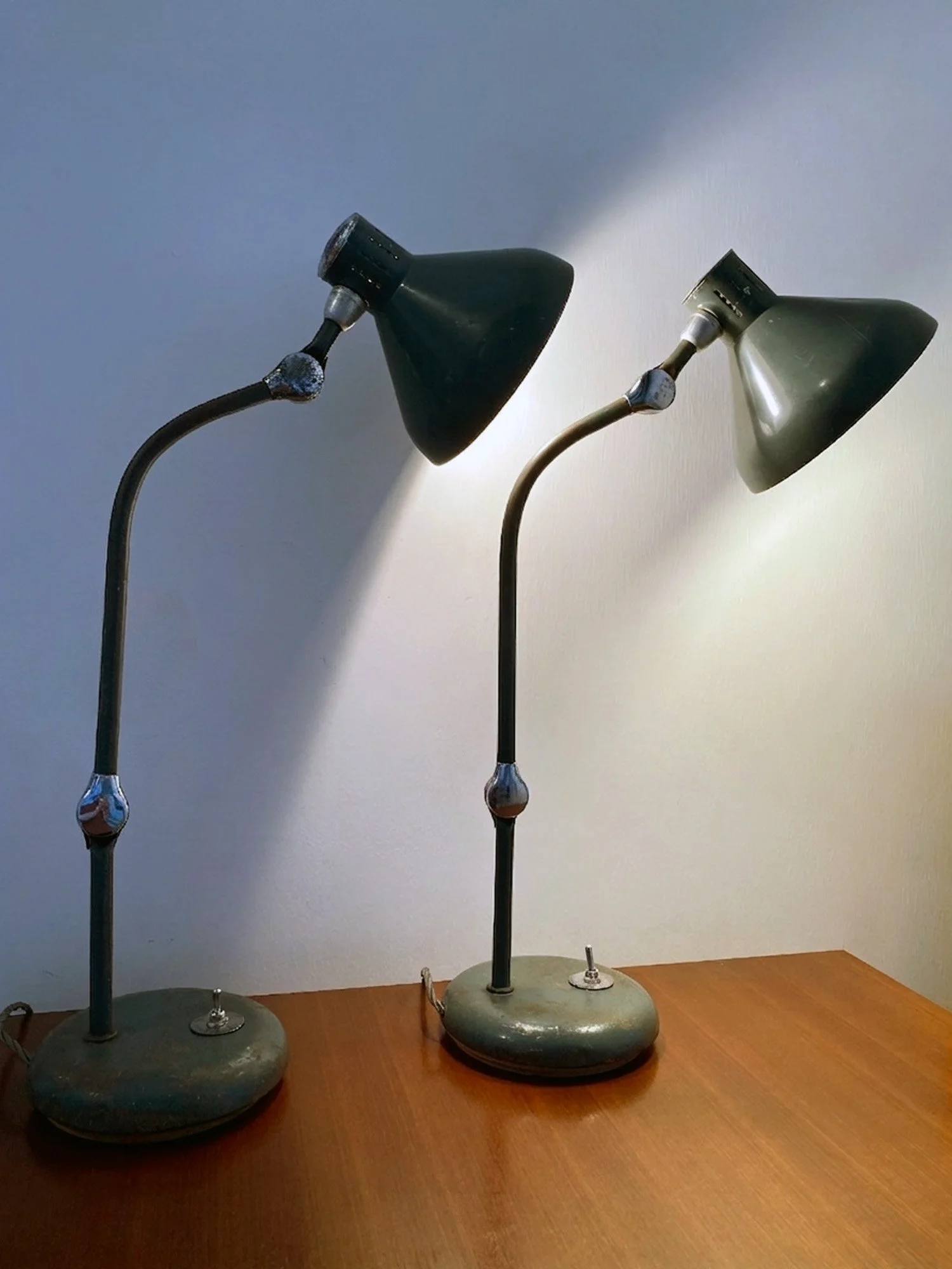 pair-of-vintage-perriand-lamps-on-wooden-desk-.jpg