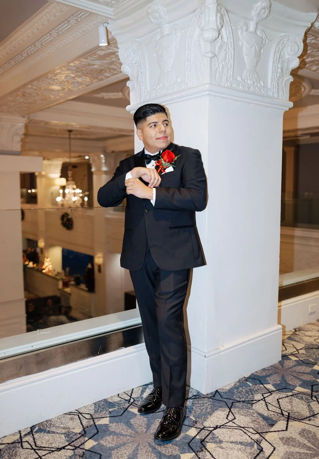 Groom portrait in The Gunter Hotel’s marble-columned lobby, showcasing the venue’s old-school elegance and architectural detail in San Antonio.