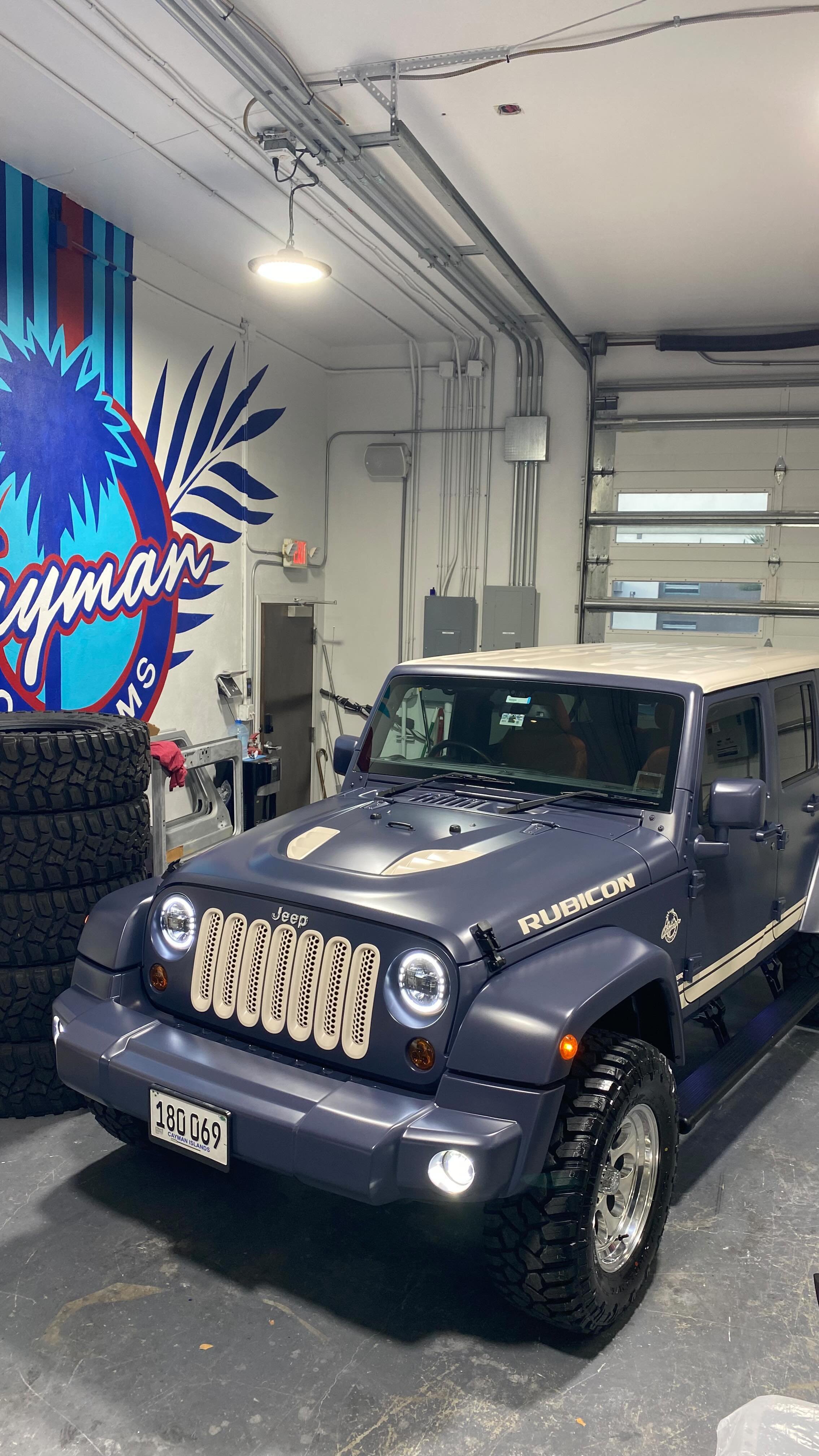 Retro creation with all the comforts of a modern Rubicon. Custom satin blue paint over “worn glove” vintage distressed leather. #detailsmatter #caymancustoms #jeep #wrangler #rubicon #custom