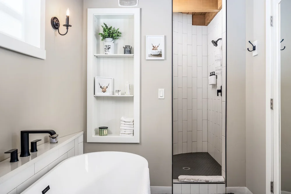 Bathroom with a freestanding tub and shower at The Silo Suites