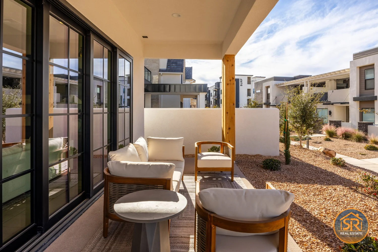 Covered patio with armchairs and an open view — from Sam Reed’s photography portfolio