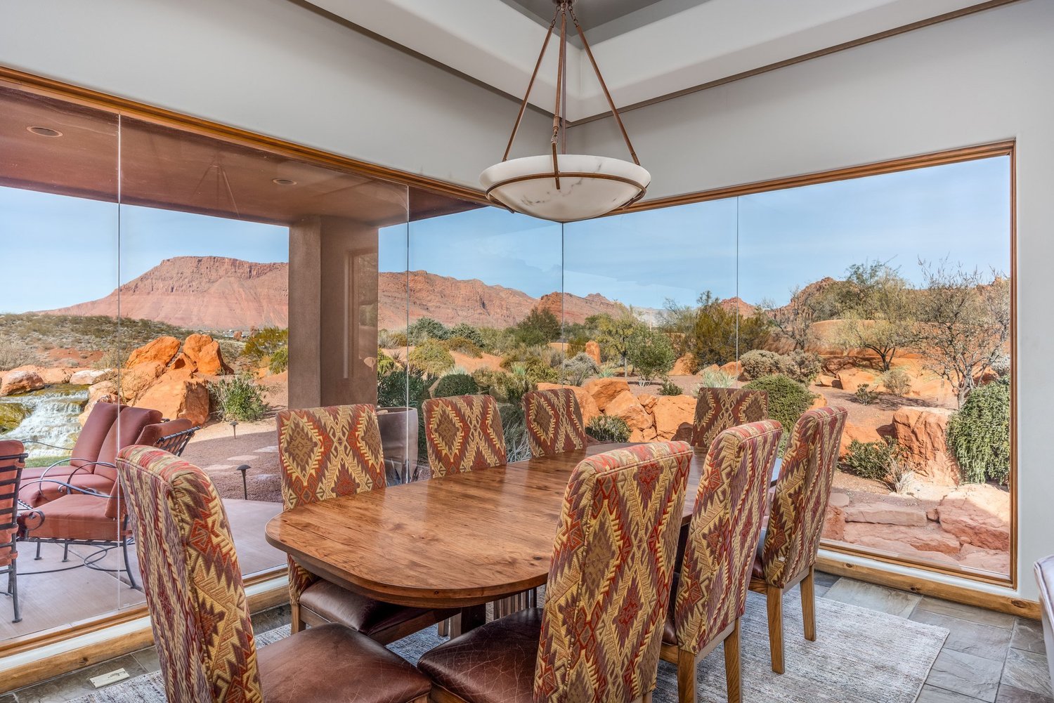 Dining room with broad windows and red-rock views — from Sam Reed’s photography portfolio