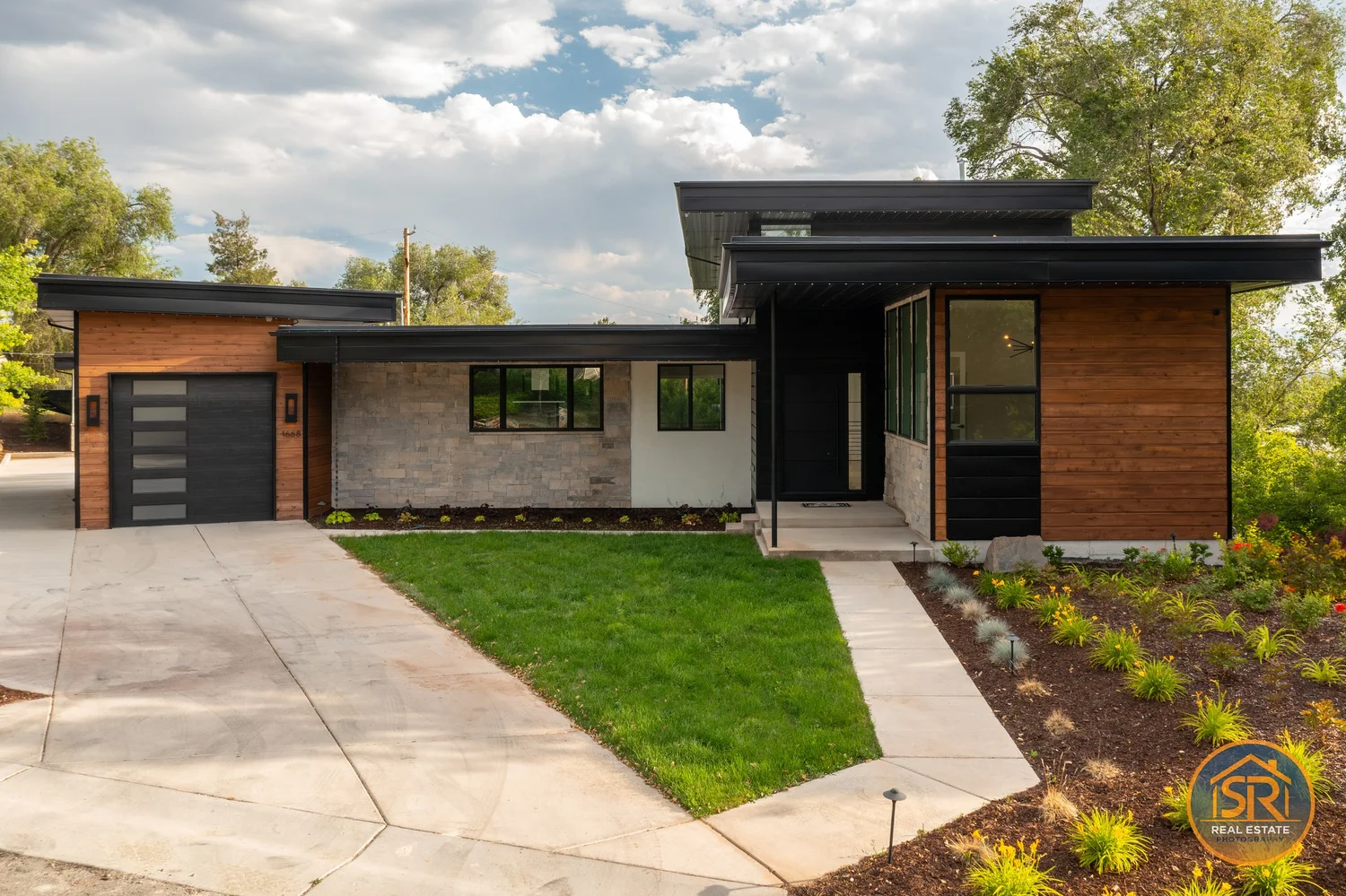 Modern home entry with glass and stone details — from Sam Reed’s photography portfolio