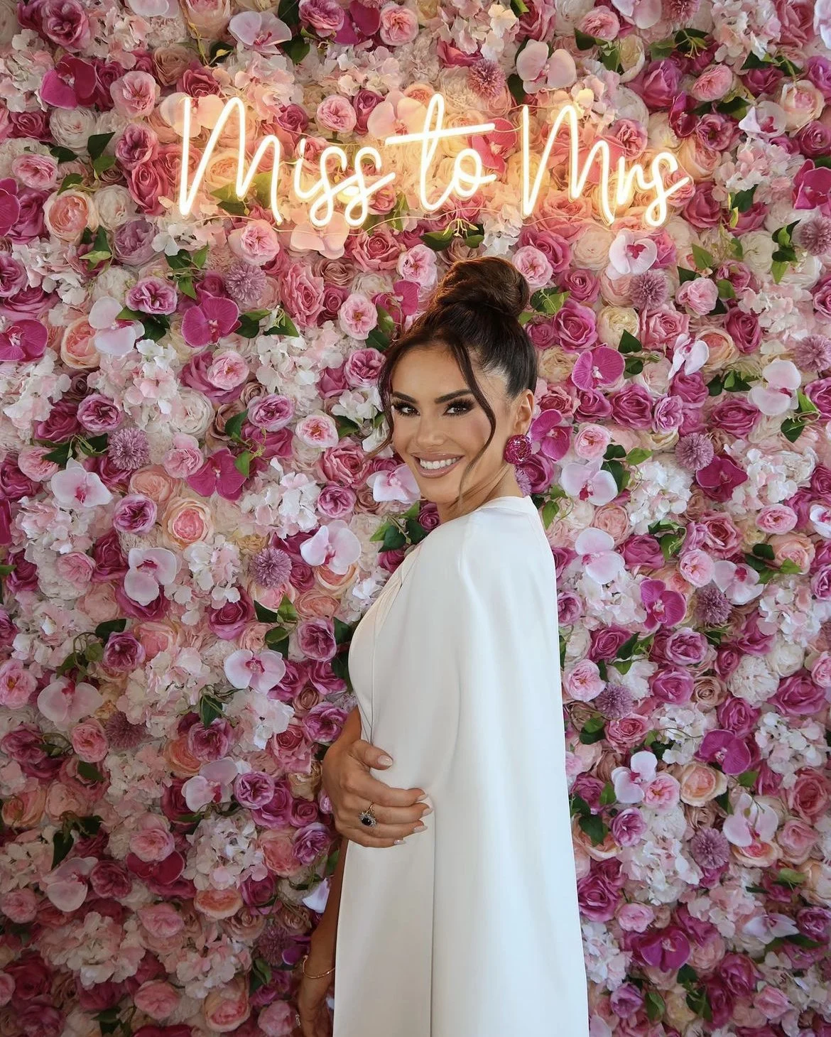 A pink flower wall at a bridal shower at Liberty House in Jersey City, NJ, by Blooms by Lily.