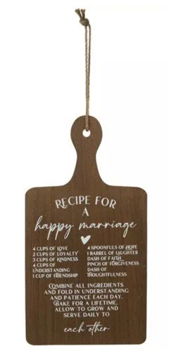 Wood sign: Recipe for a Happy Marriage. Used with a black stand.