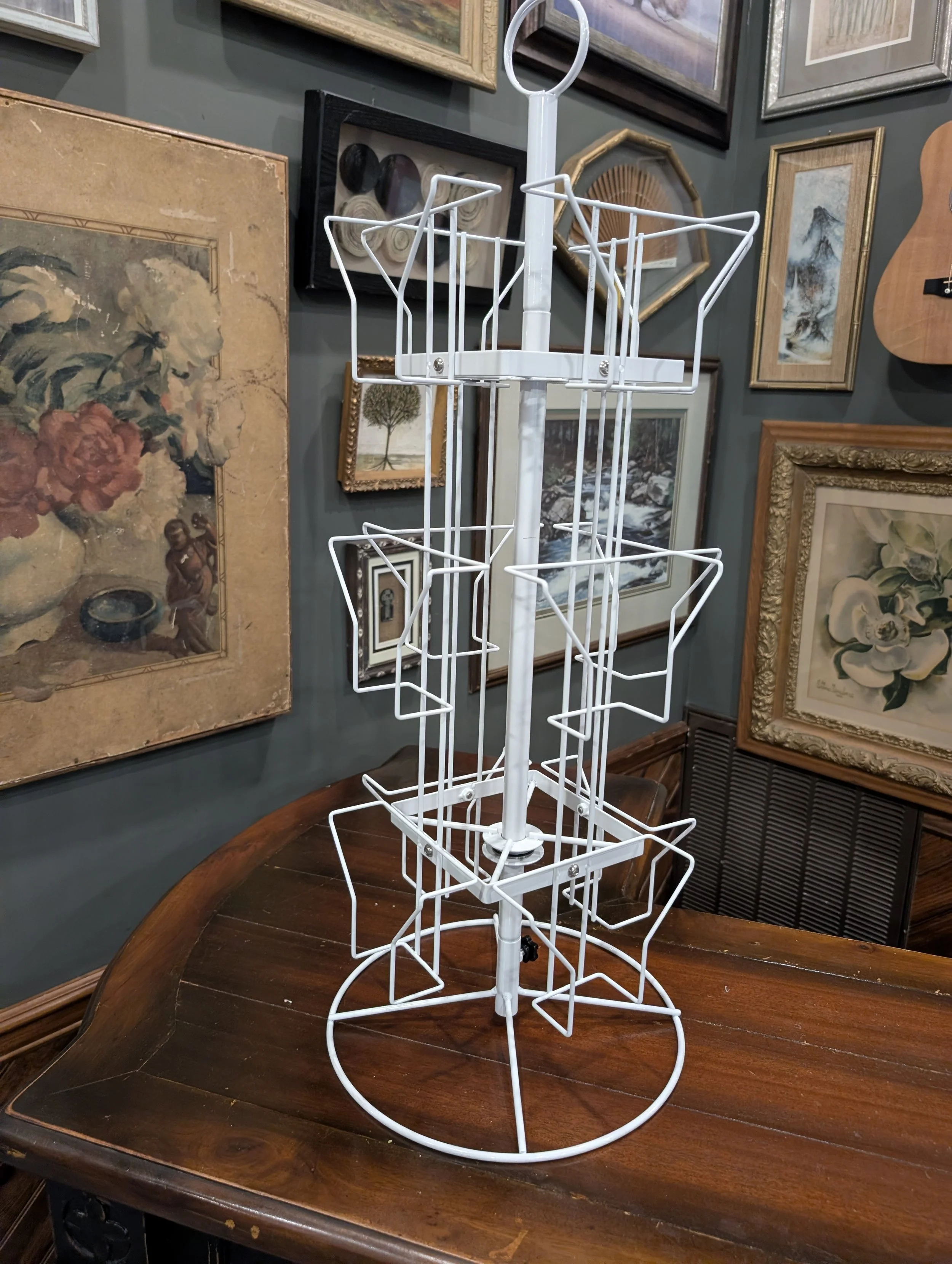 Postcard rack. Multi-tier, 360-degree spin. Approximately 2-ft tall.