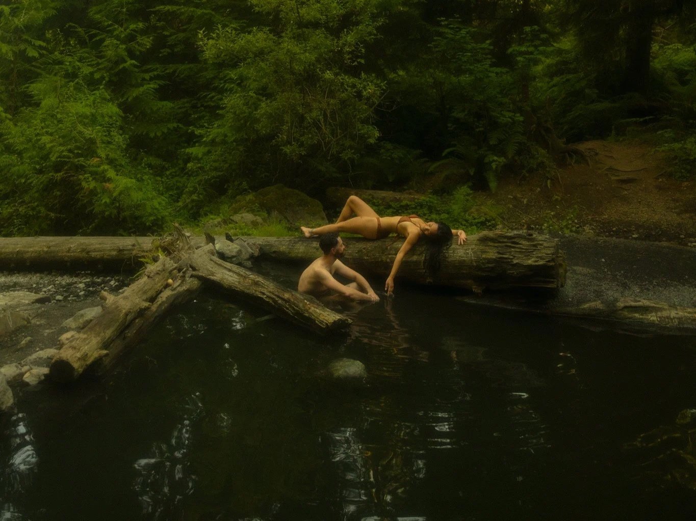 an elopement couple relaxing in a hot spring in the North Cascades