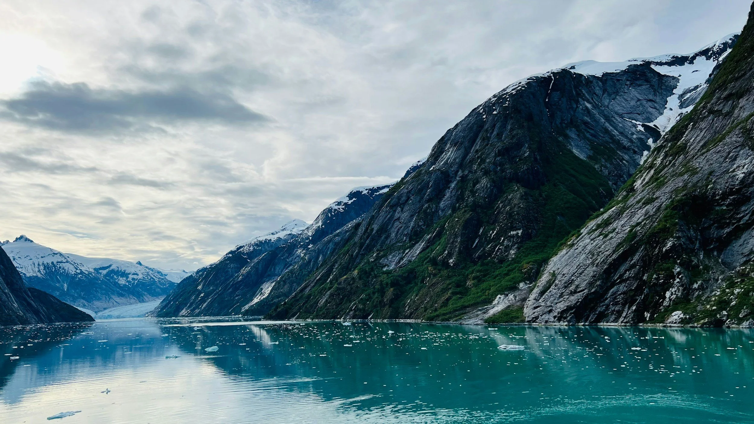 mountains jutting out of the water in Alaska