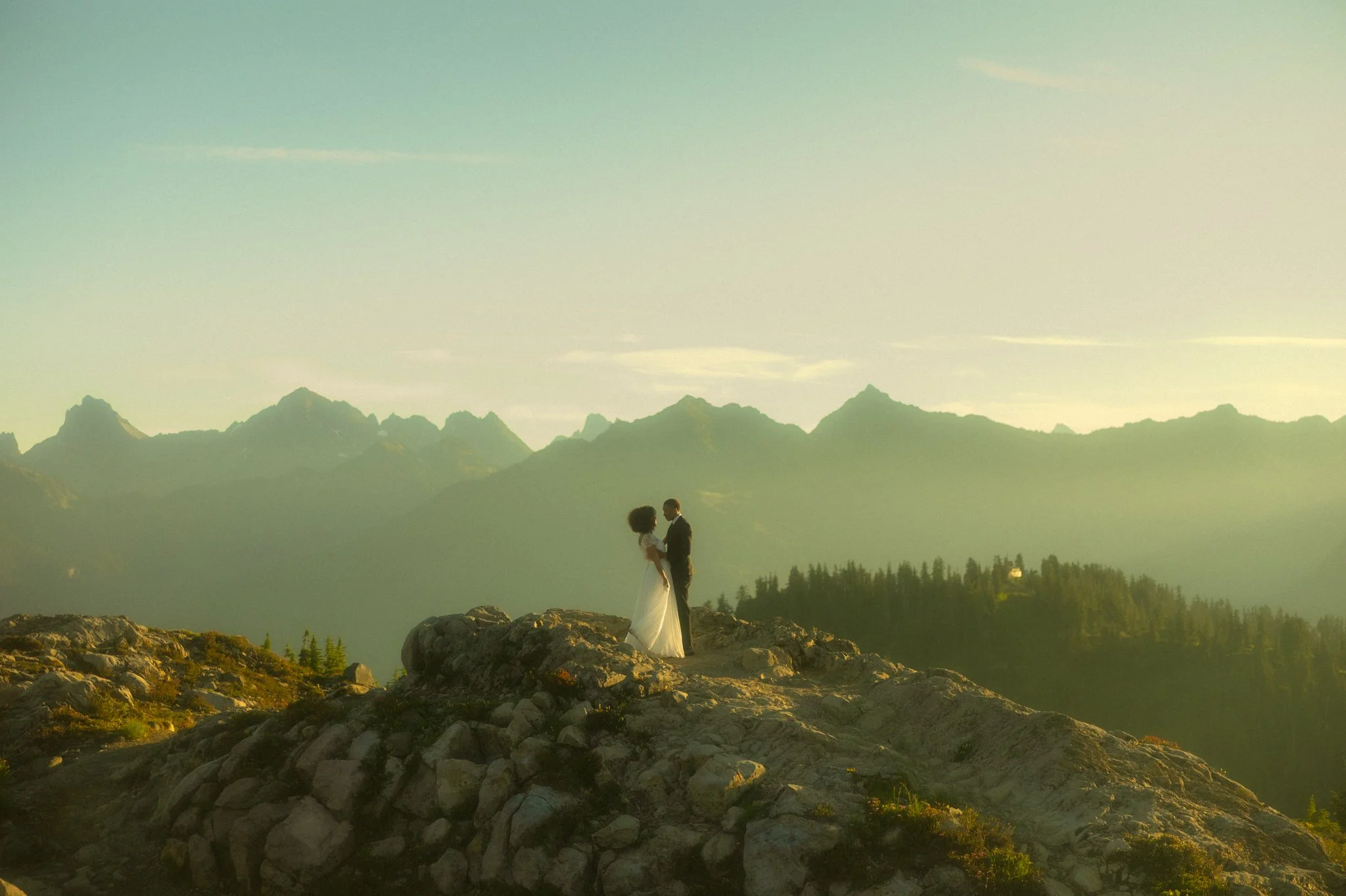 a couple eloping on a trail in the mountains in Mt Baker