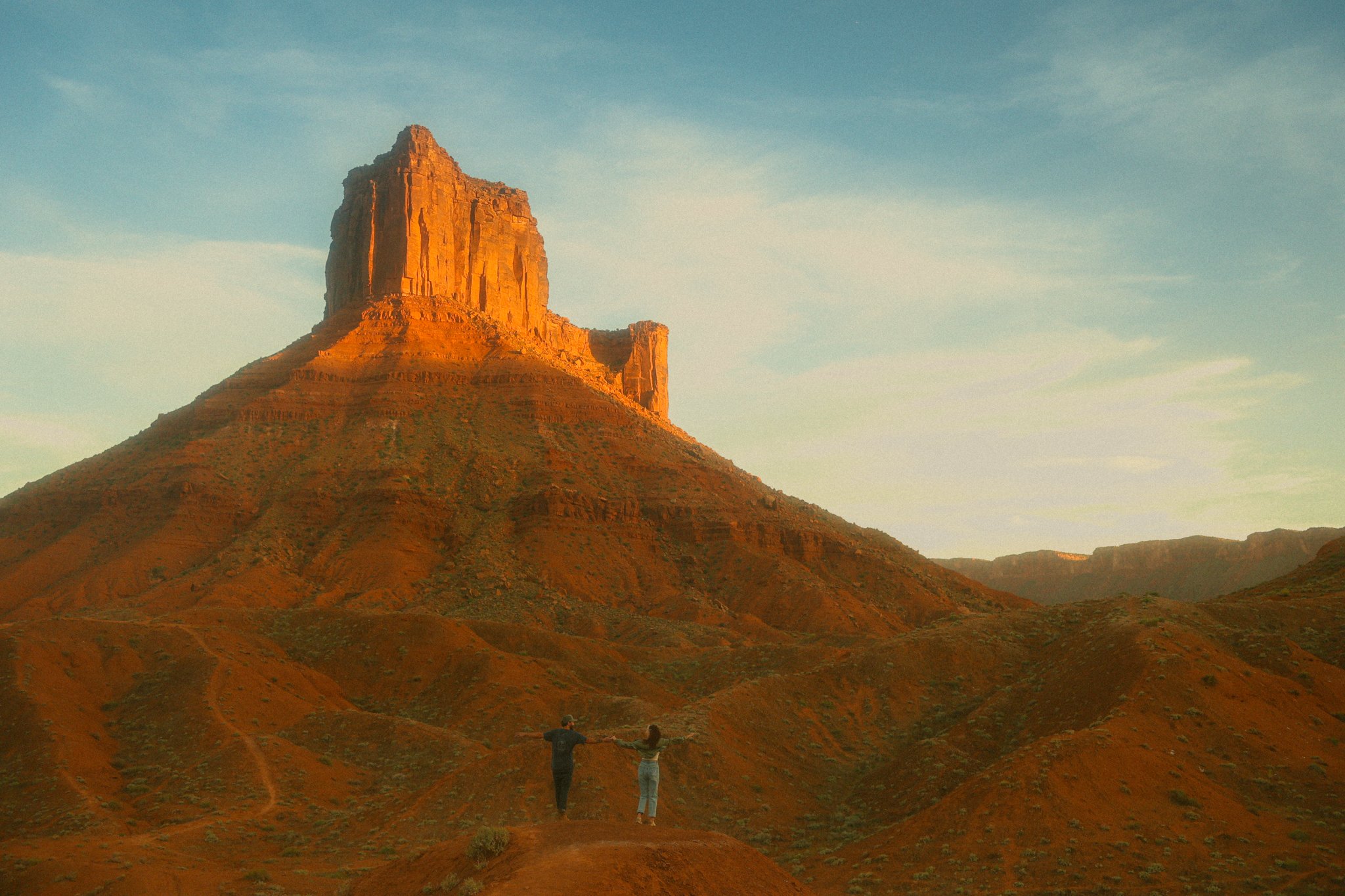 a couple exploring the red desert in Moab, Utah
