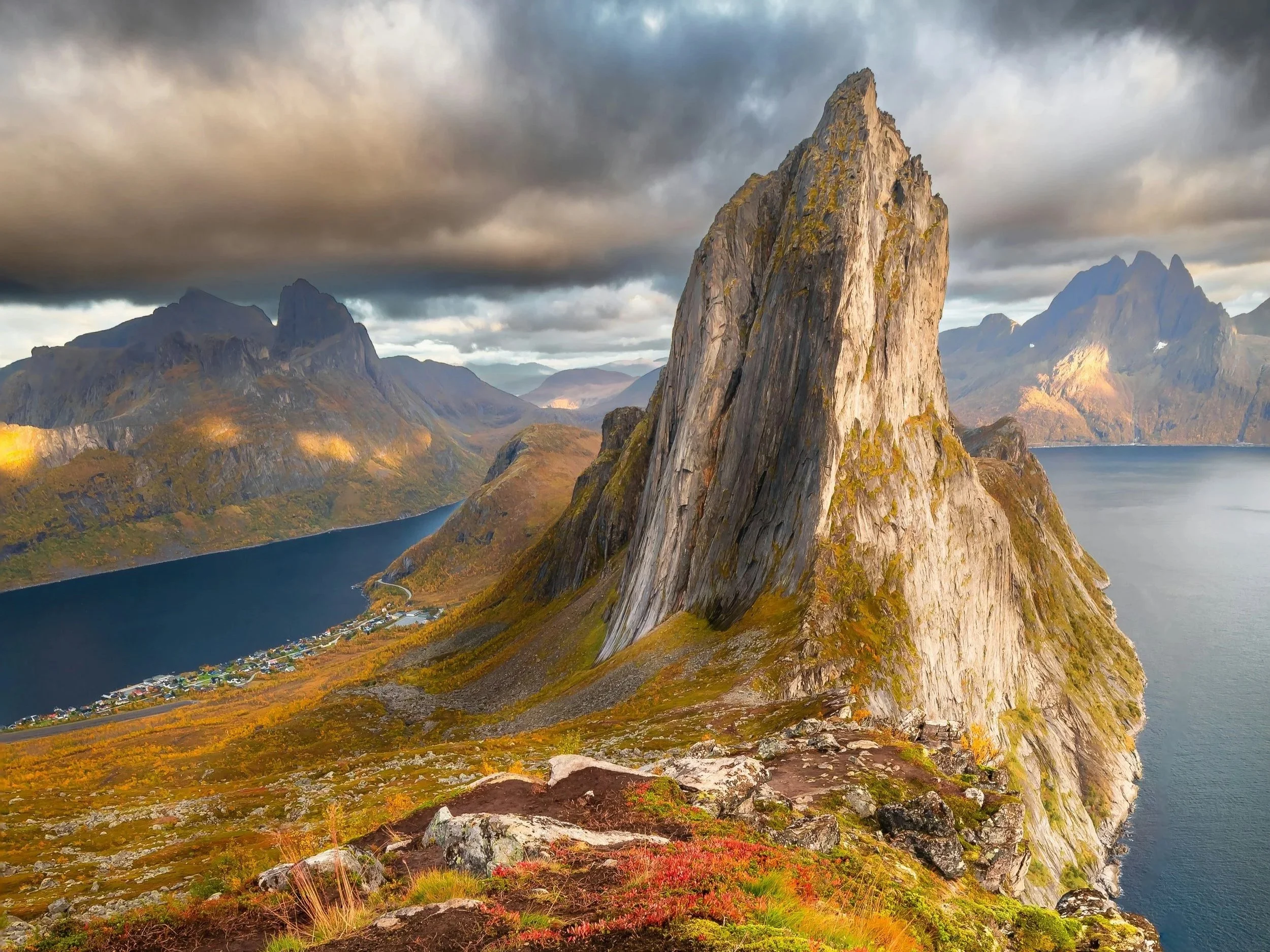 a landscape photo of a scenic mountain and fjord view hike in Senja, Norway