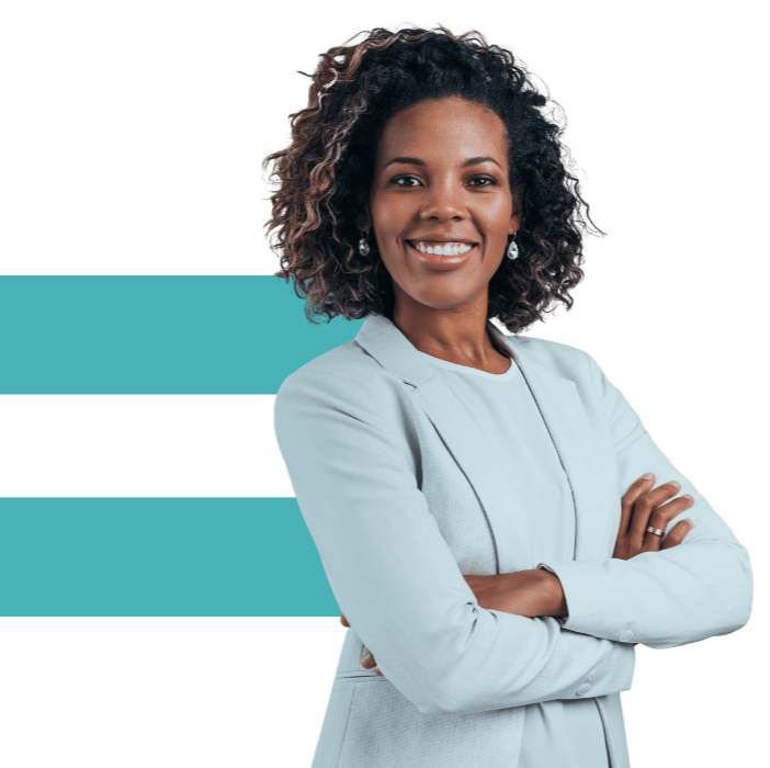 Nonprofit professional woman wearing a blazer and standing confidently with arms crossed and smiling.