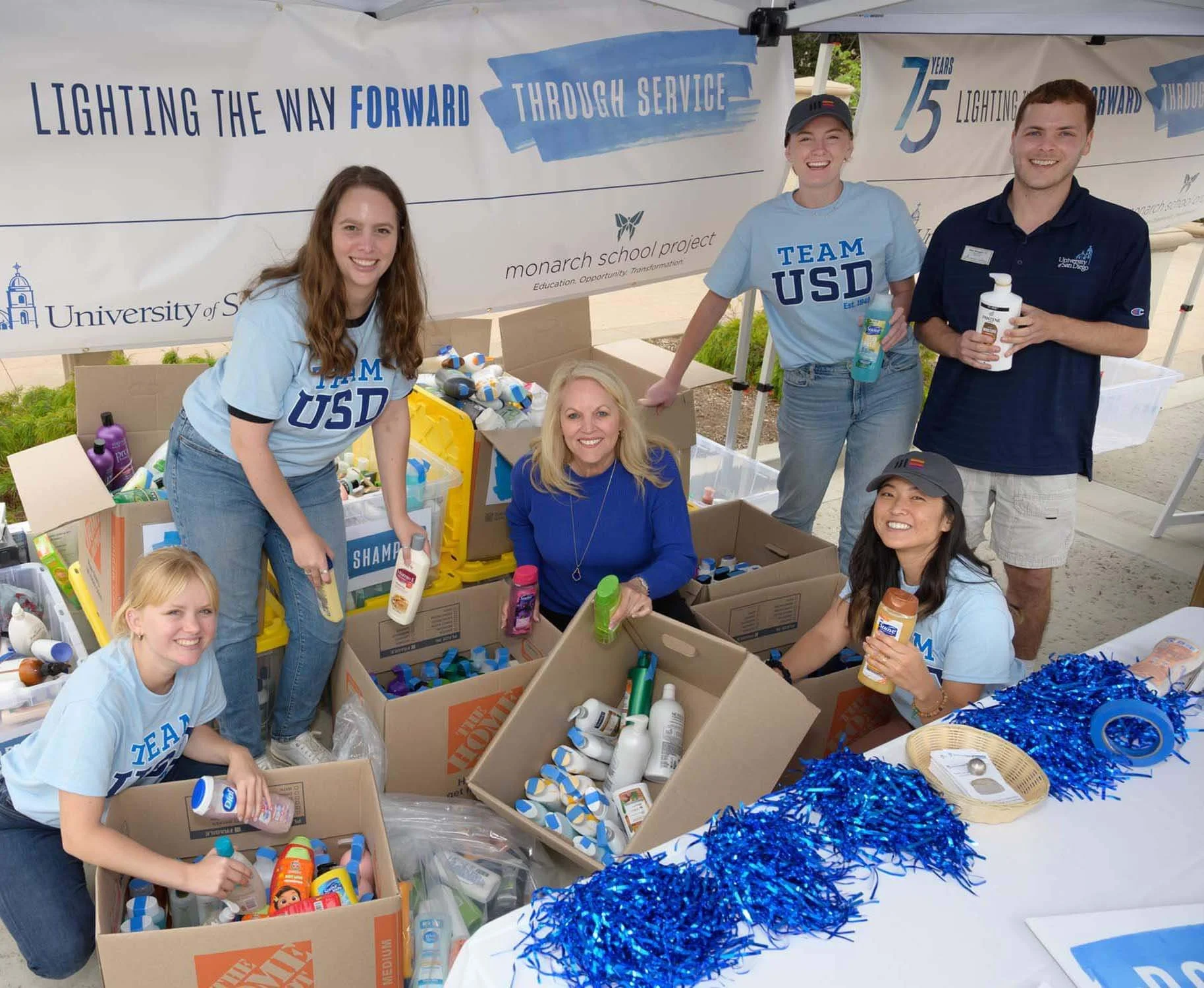 University of San Diego volunteers and Mission Edge Corporate Social Responsibility team sorting toiletry donations for the monarch school project