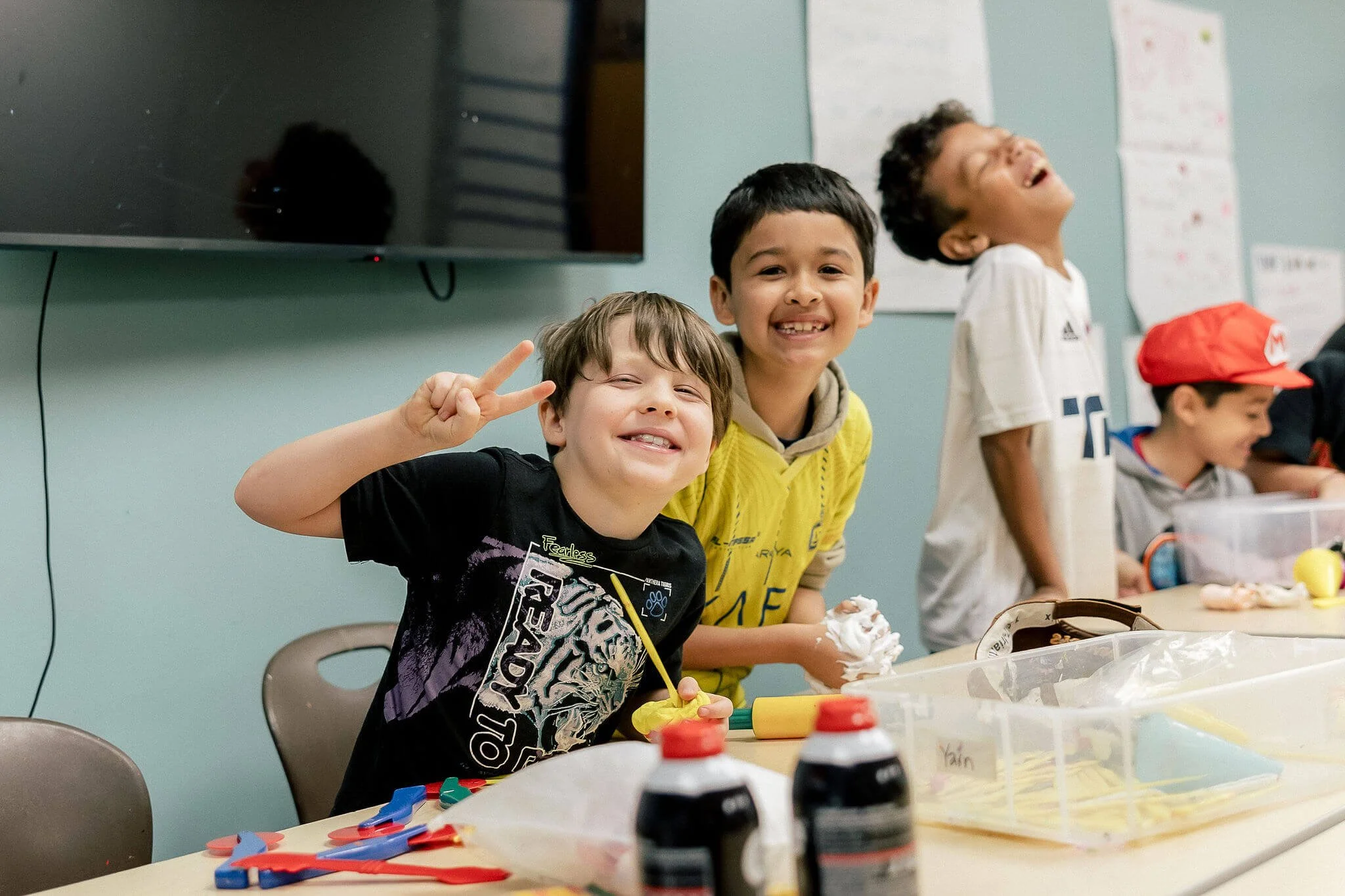 young students having fun doing crafts