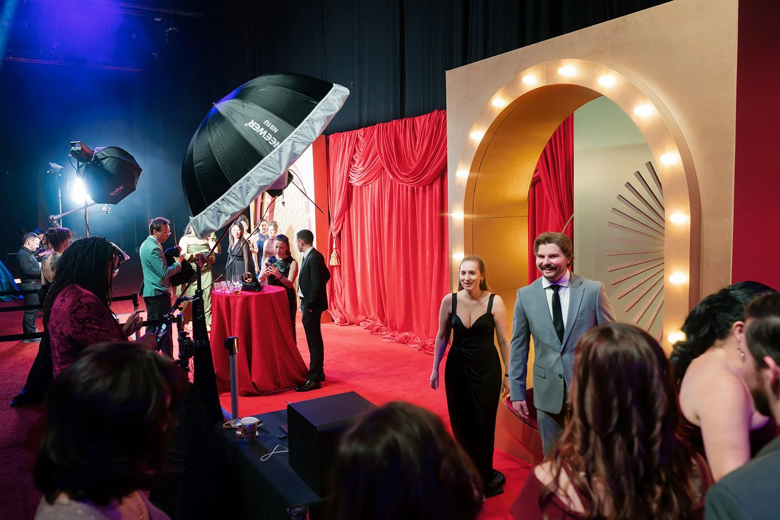 Guests exiting photo booth moment during a old hollywood themed event