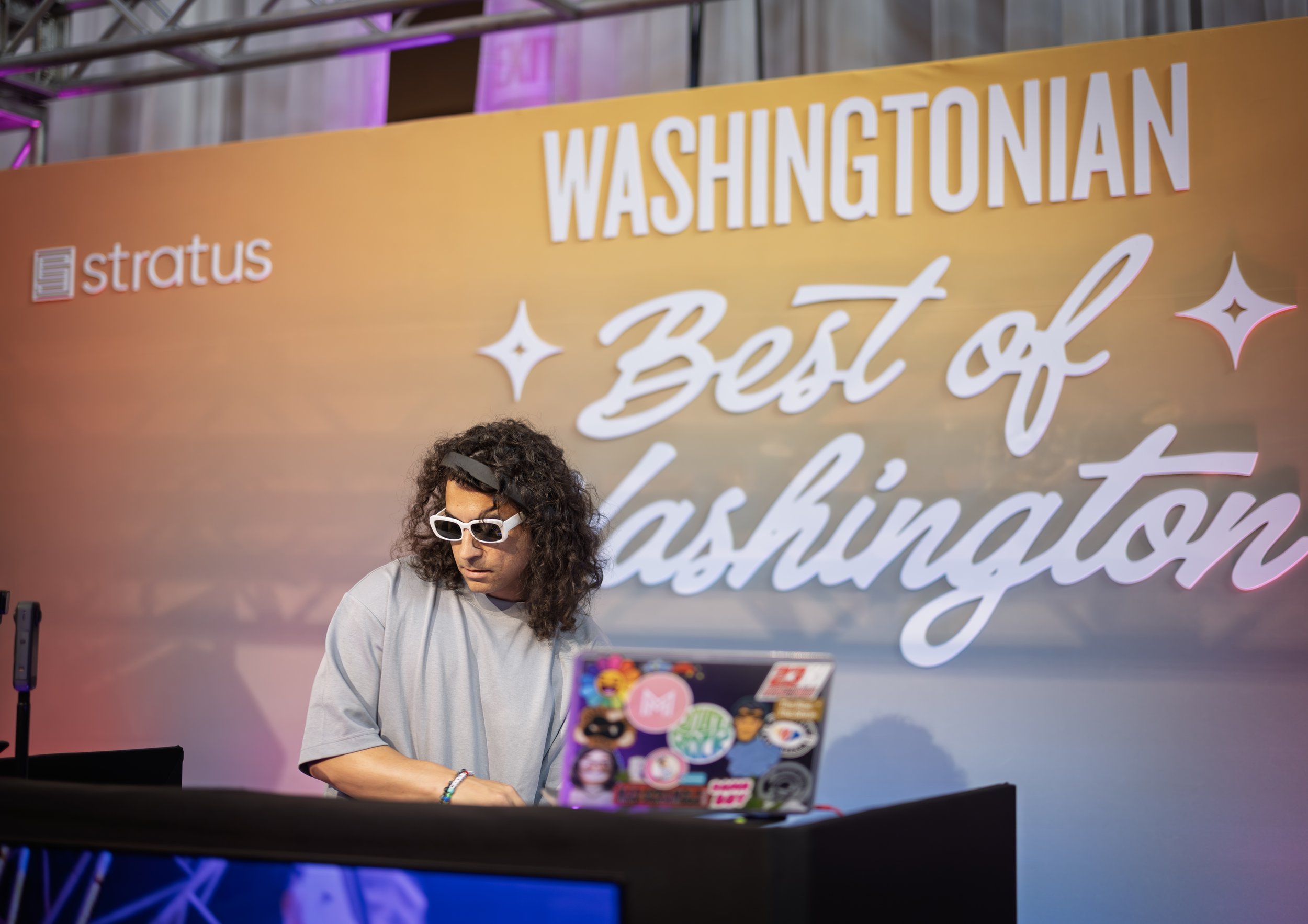DJ in booth during the Washingtonian magazine Best of Washington culinary showcase event 2025. Event produced by DC event company Stratus Firm