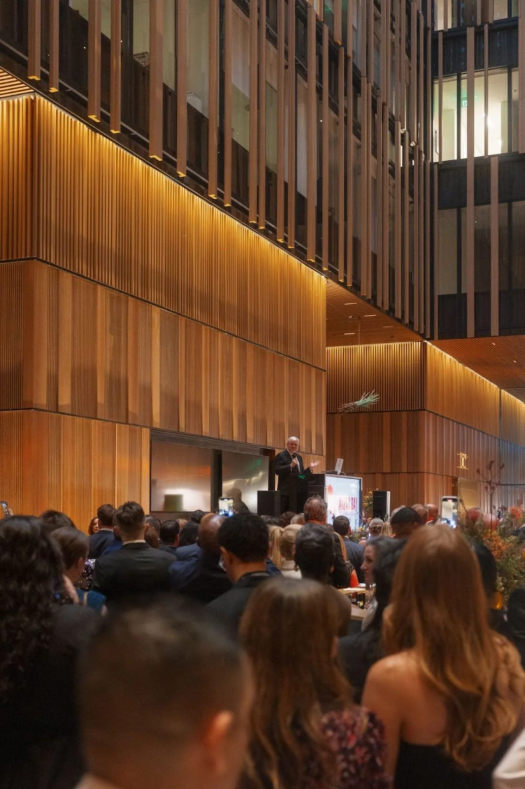 Speaker behind podum on stage at the Australian Embassy for an event produced by Stratus Firm in Washington, D.C.