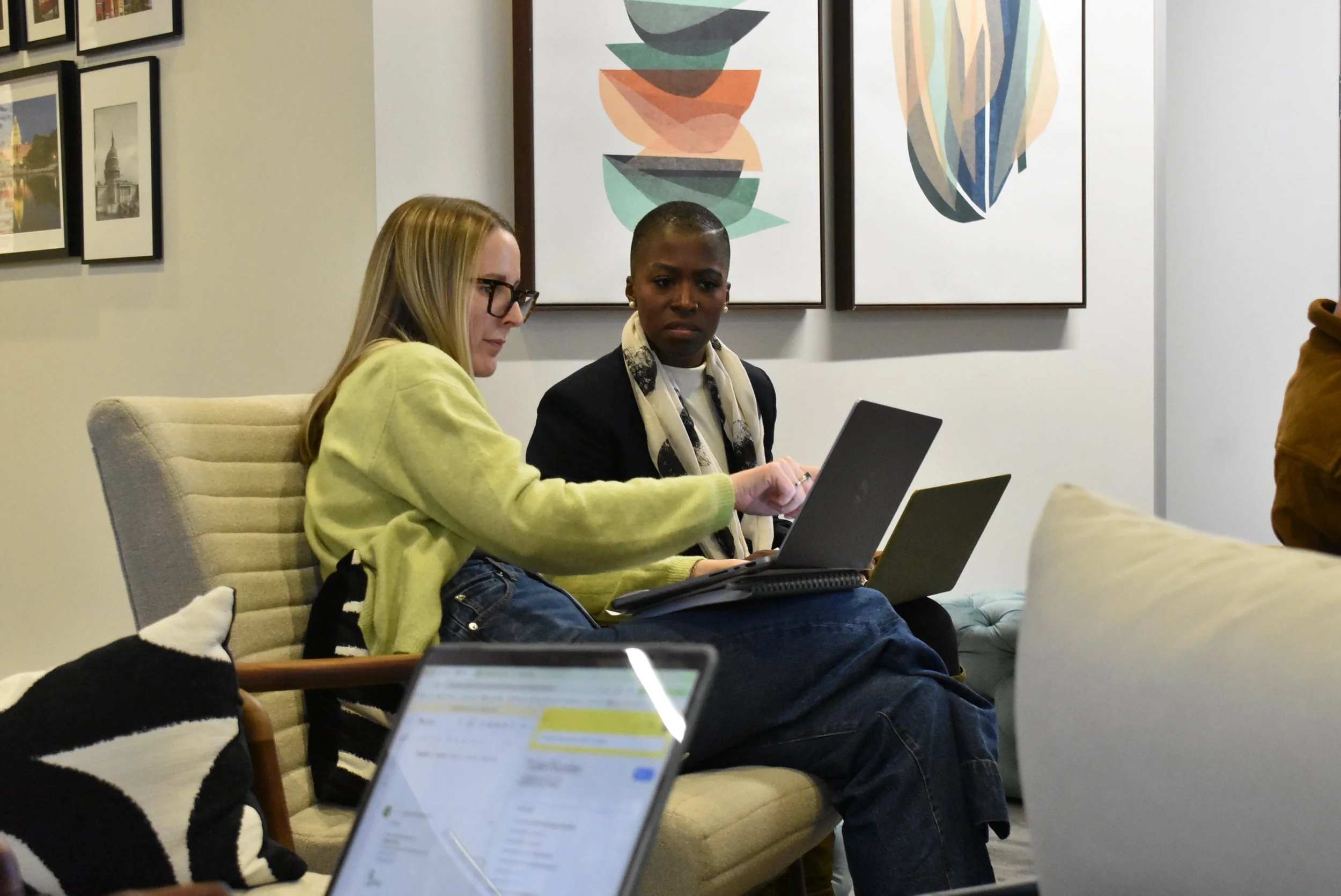 Two event producers at Stratus Firm developing an event