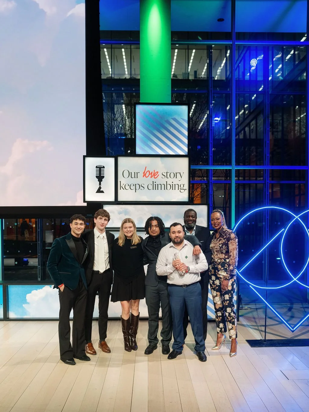 Attendees in front of branded set piece during the Bozzuto BMA road show.