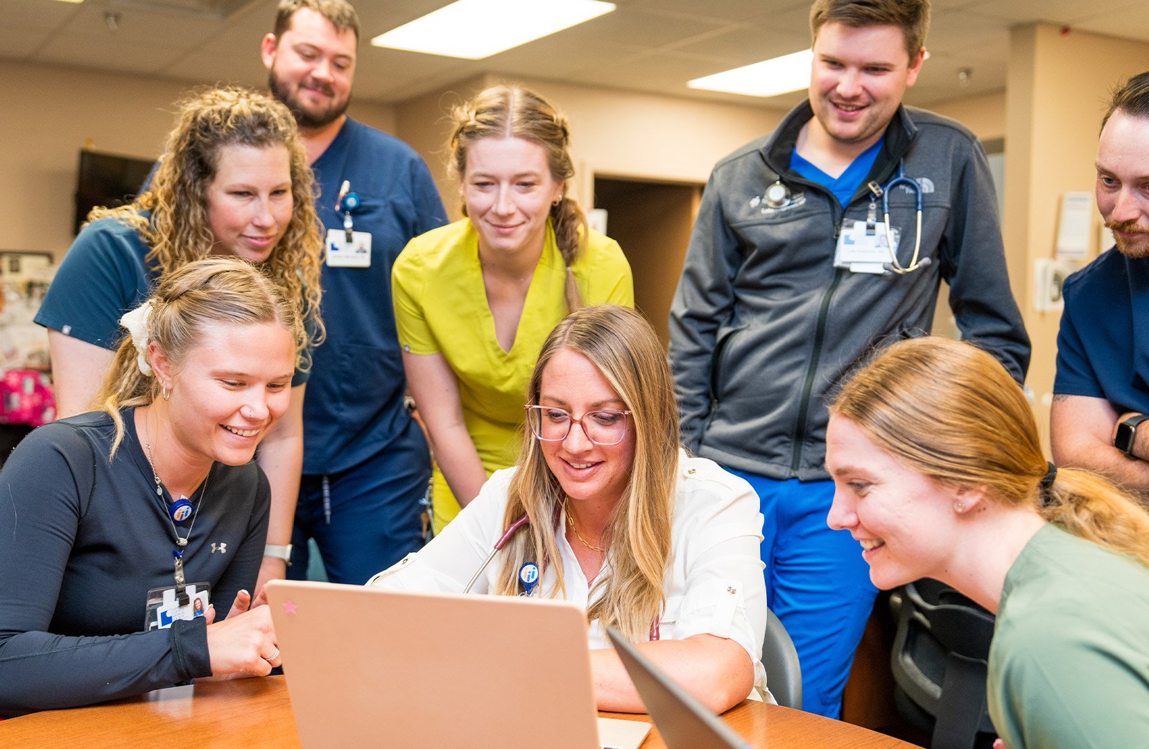 Dr-Sanely-with-residents-in-office-wide.jpg