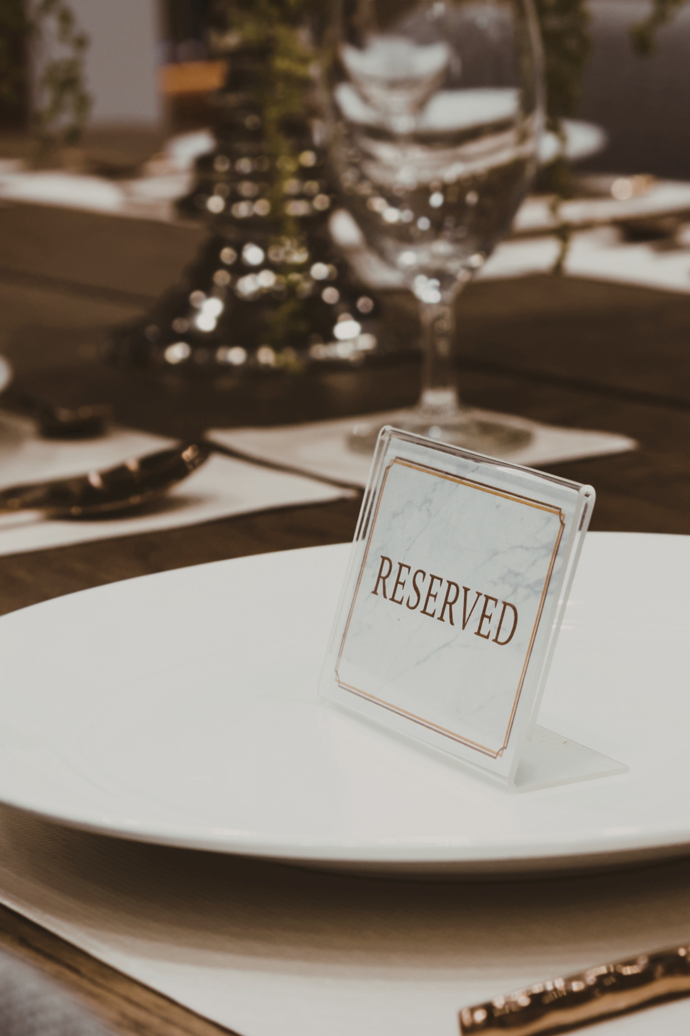 Intimate executive dinner table setting with custom details