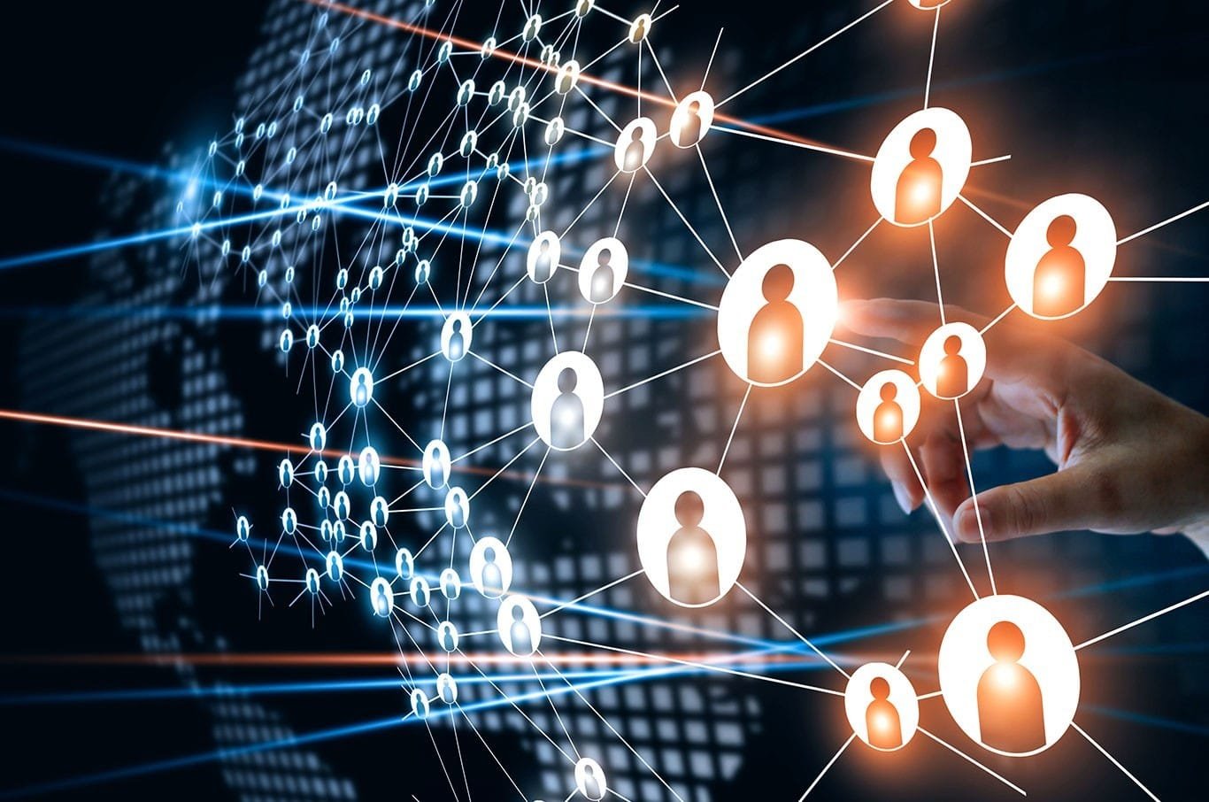 Digital network of interconnected human icons overlaid on a world map, with a person's hand pointing at the network.