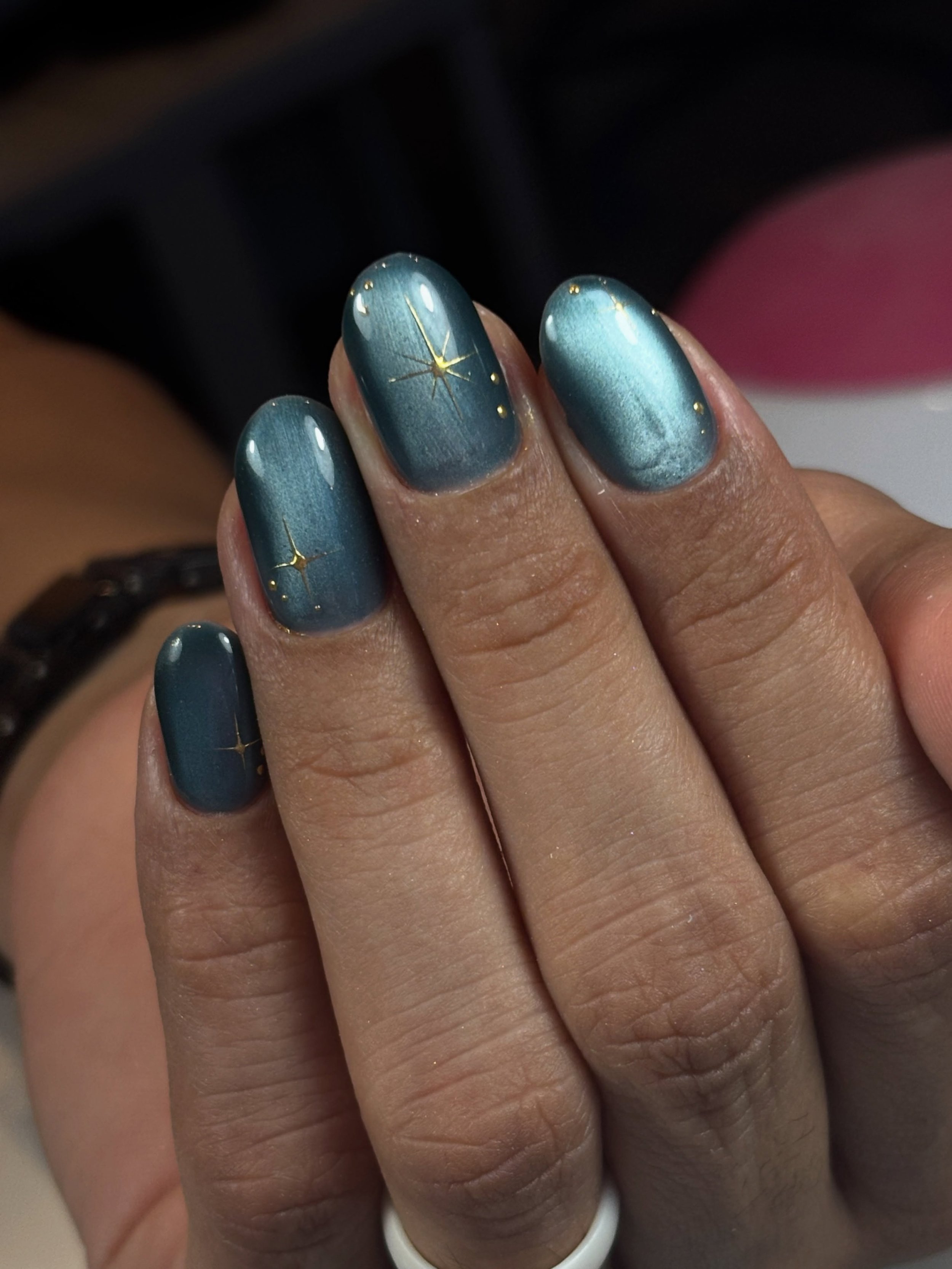 What an elegant teal blue cat eye with a touch of golden sparkles!🤩🩵✨ done by Halie 
&bull;
#russianmanicuredenver #russianmanicure #denvernails #denvernailsalon #tealcateyenails
