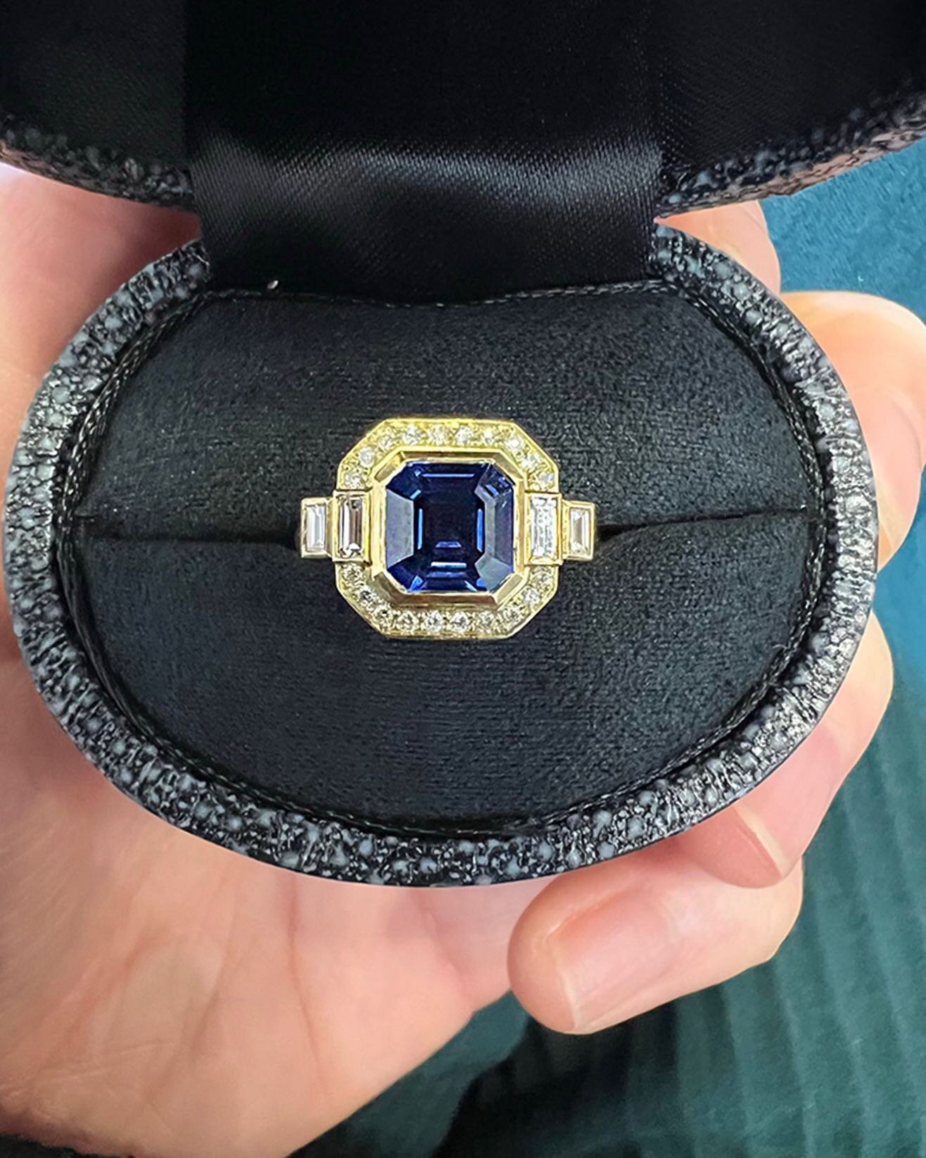 For Sophie 〰️ A beautiful Octagon cut Ceylon sapphire set in a halo of round brilliant cuts and stepped baguette cut diamonds in 18k yellow gold. A classic coloured stone with a modern twist will forever be a firm favourite 💙

#emmaclarksonwebb #eng