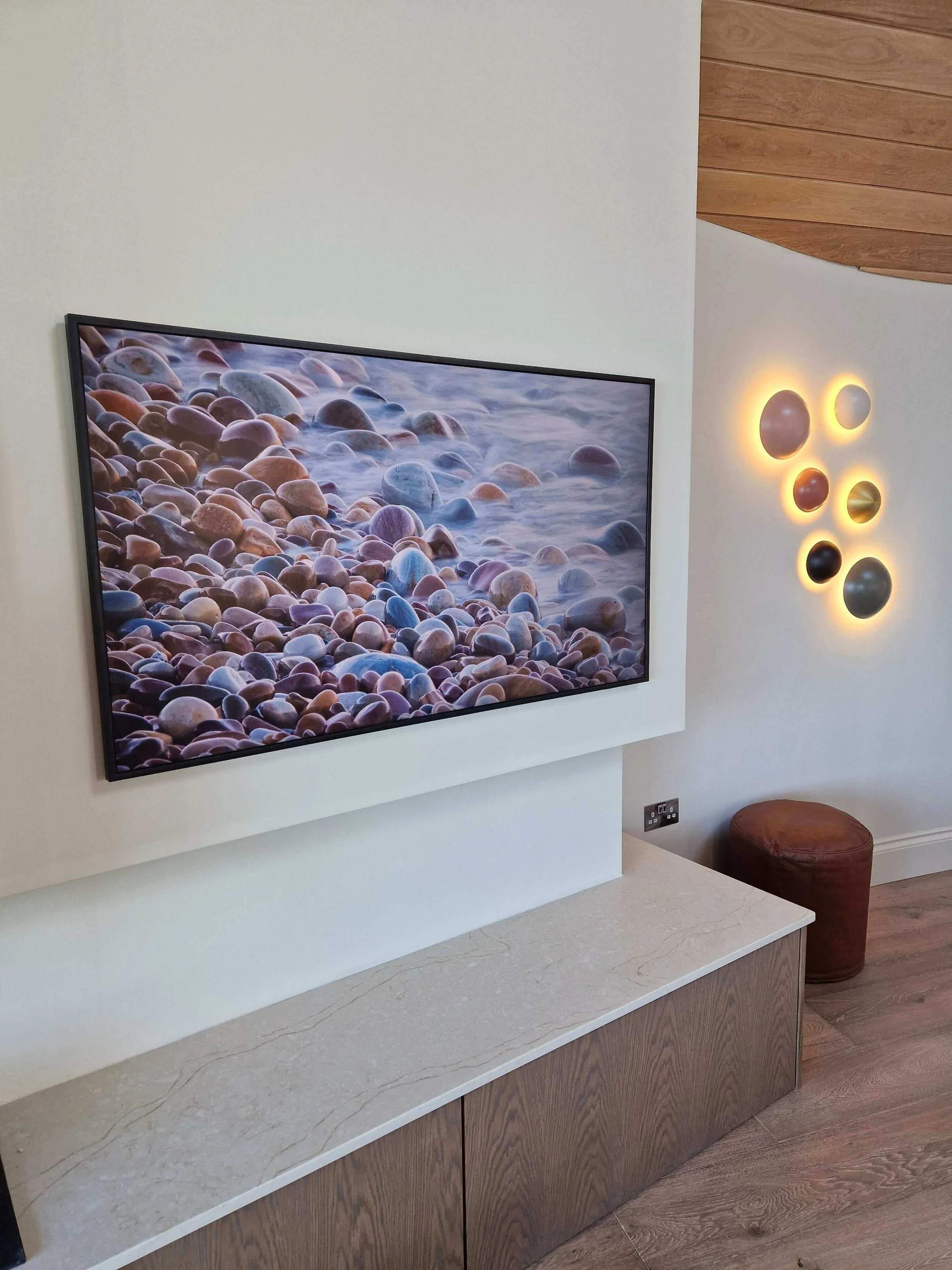 Samsung Frame professionally mounted on wall. Chosen and installed to fit interior of the space.