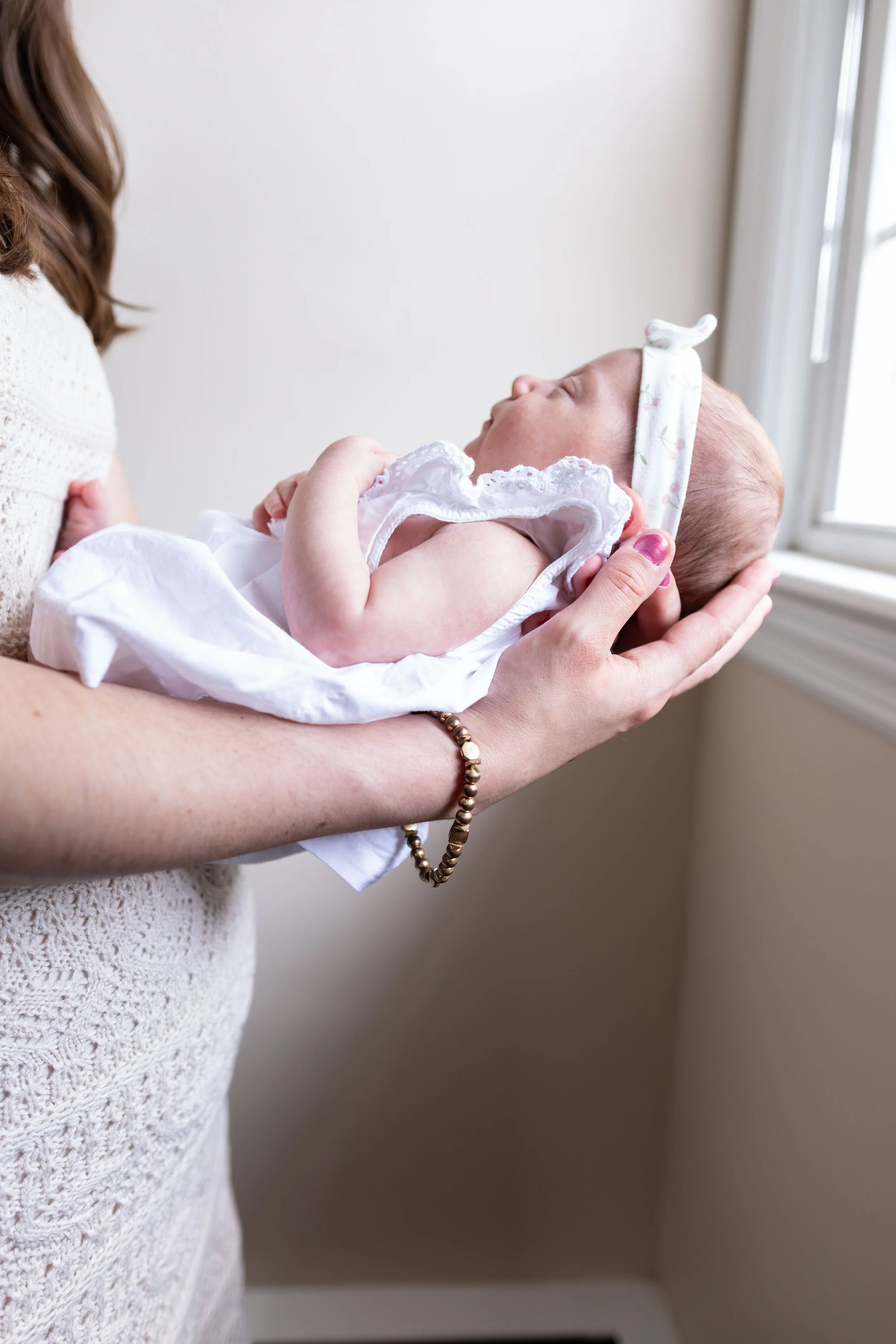 Side profile of baby - newborn lifestyle portrait taken in Somerset County, New Jersey