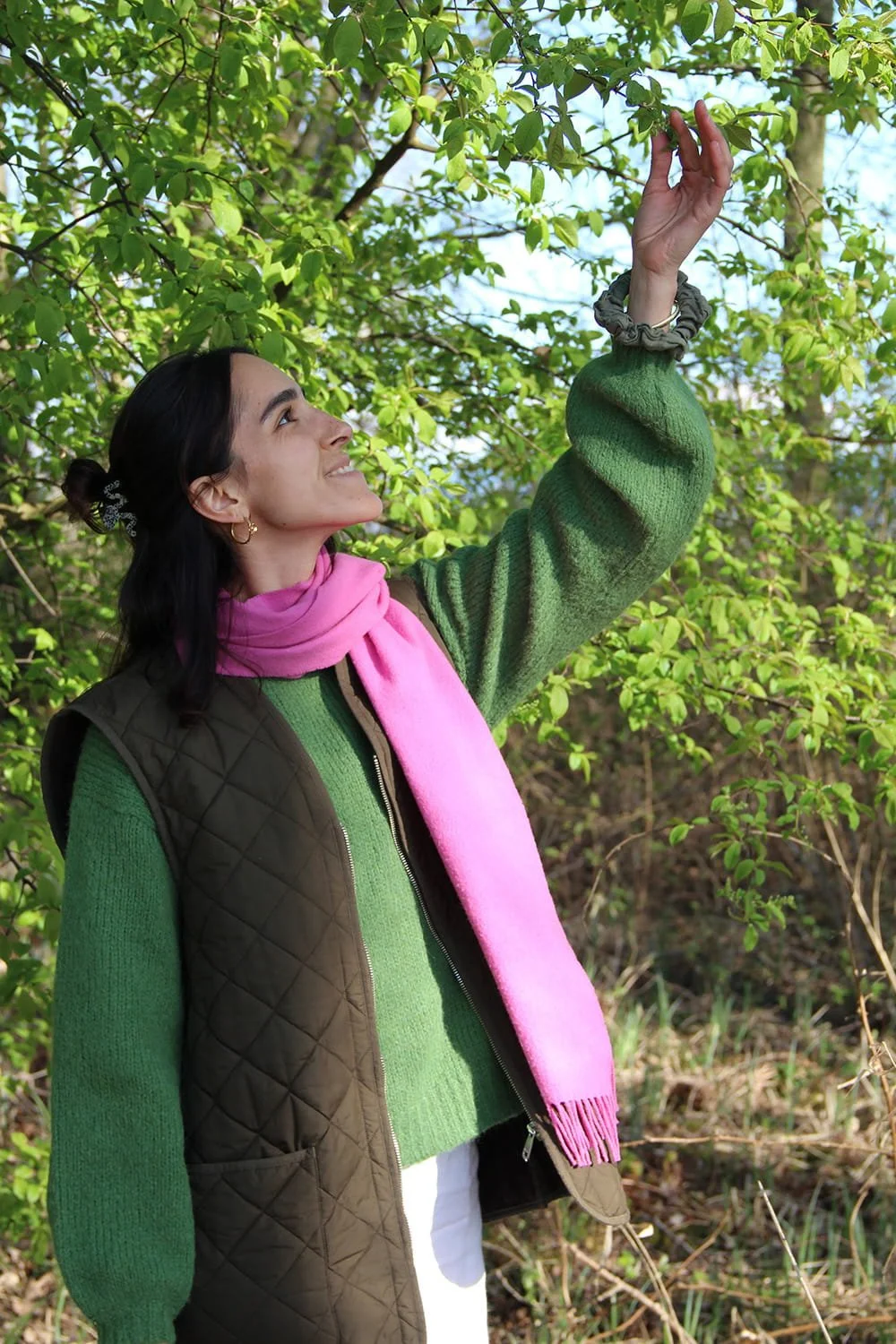 Jil Bianca looking up at tree branches, illustrating a safe space for self empowerment, freedom, and clarity.