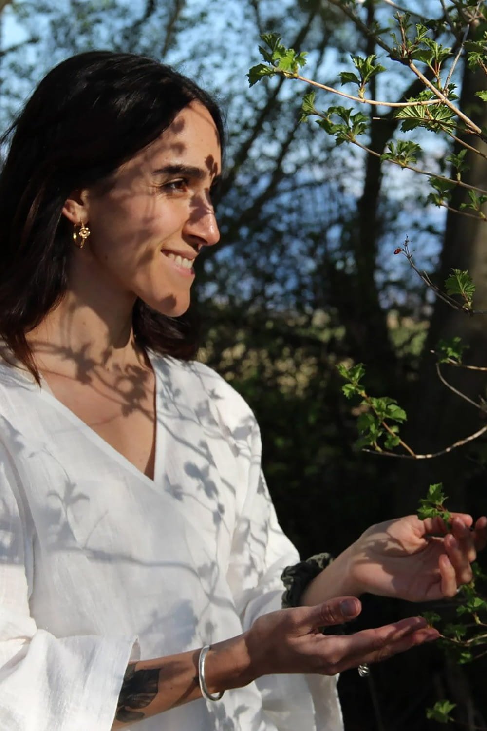 Jil Bianca in nature, representing her life journey and interconnected growth.