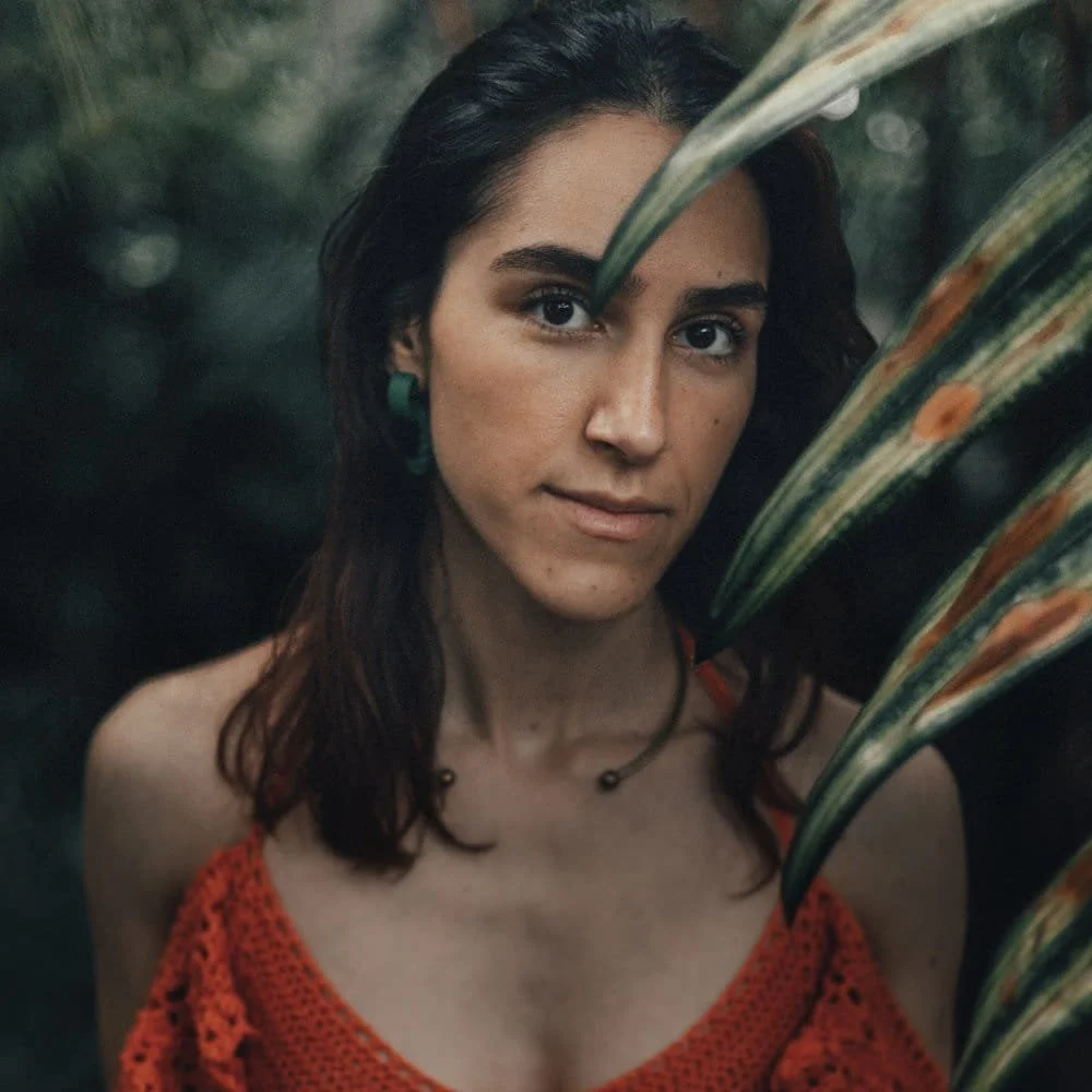 Portrait of Jil Bianca in a natural setting, symbolising empowerment and authenticity of her body based therapy and counselling.