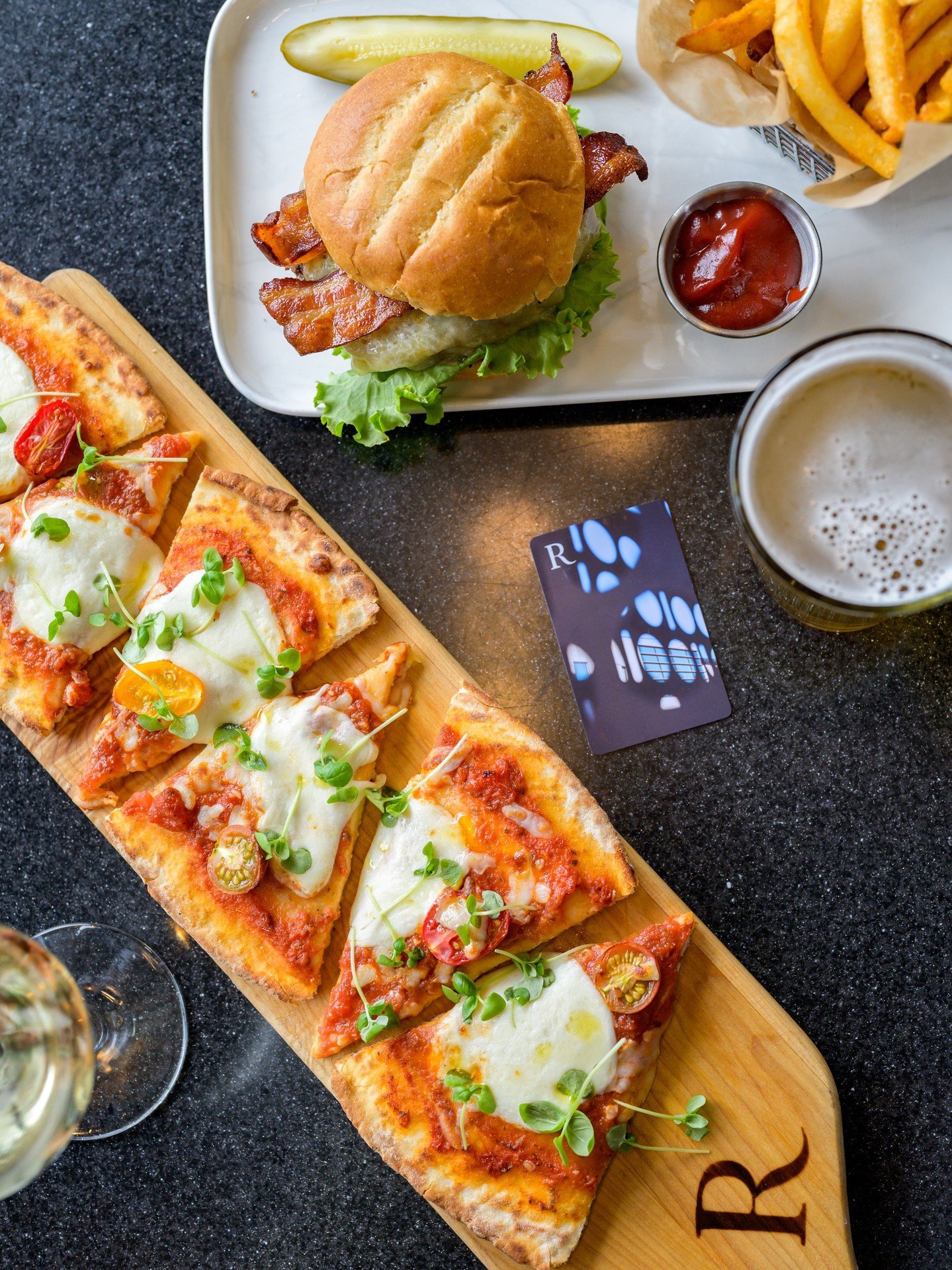Pure Italian classic, perfected right here in Patriot Place! 🍅🌿 Our Margherita Flatbread features imported San Marzano tomatoes, fresh basil, creamy mozzarella, and sweet cherry tomatoes, all baked to perfection in our stone hearth. A simple, pleas