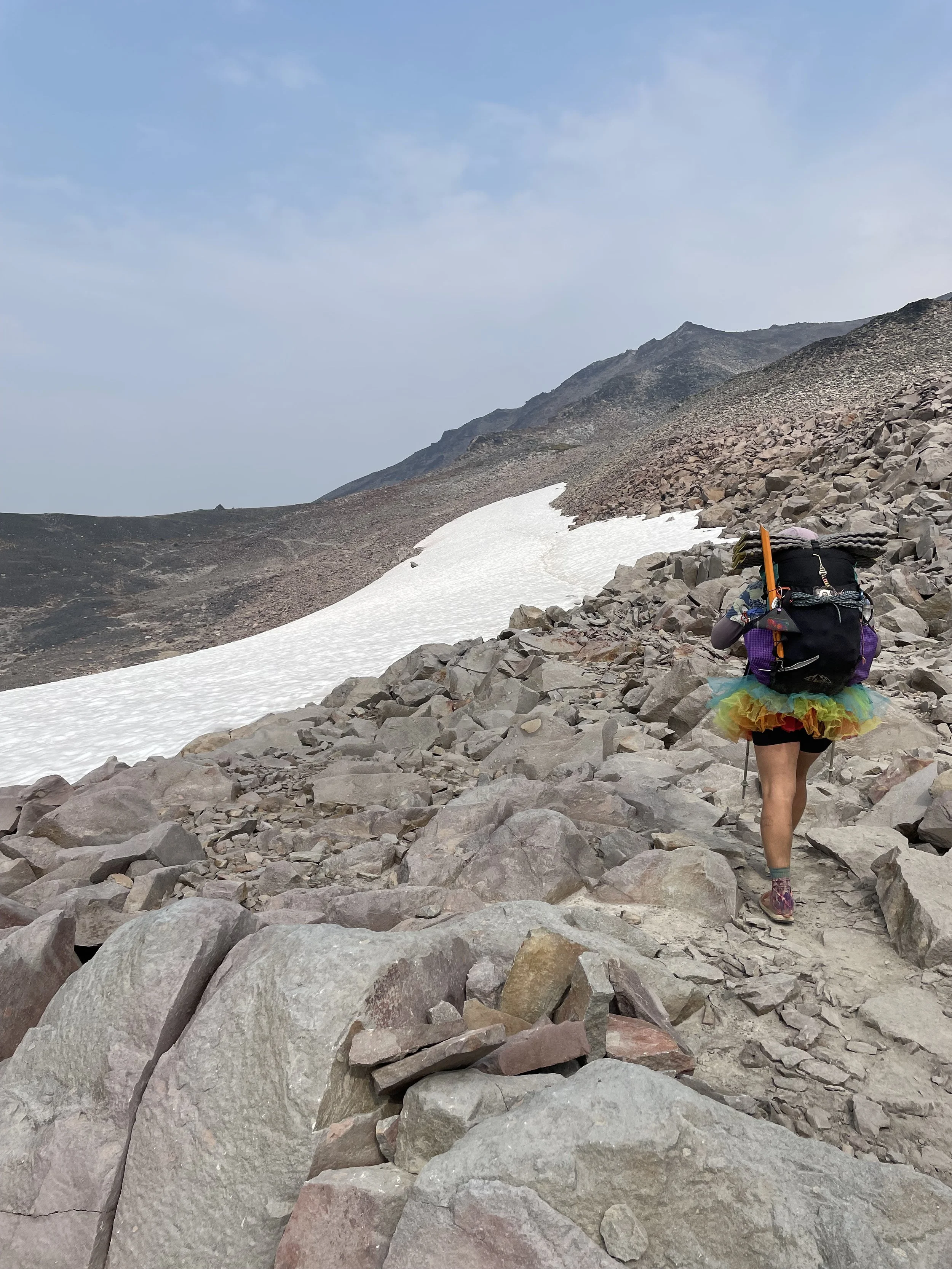 Following a hiker named Em across a snowfield