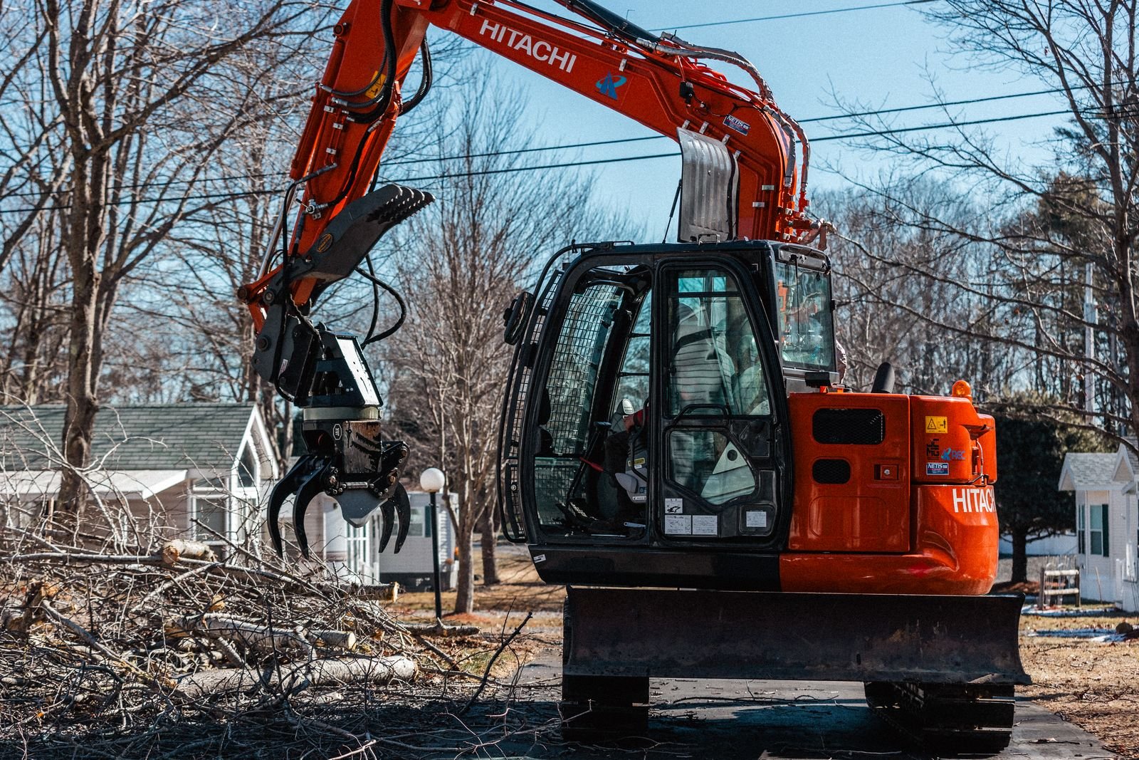 Taylor Tree Services primary piece of equipment, a hitachi zx75 with a grapplesaw. Pictured with a tree shear.