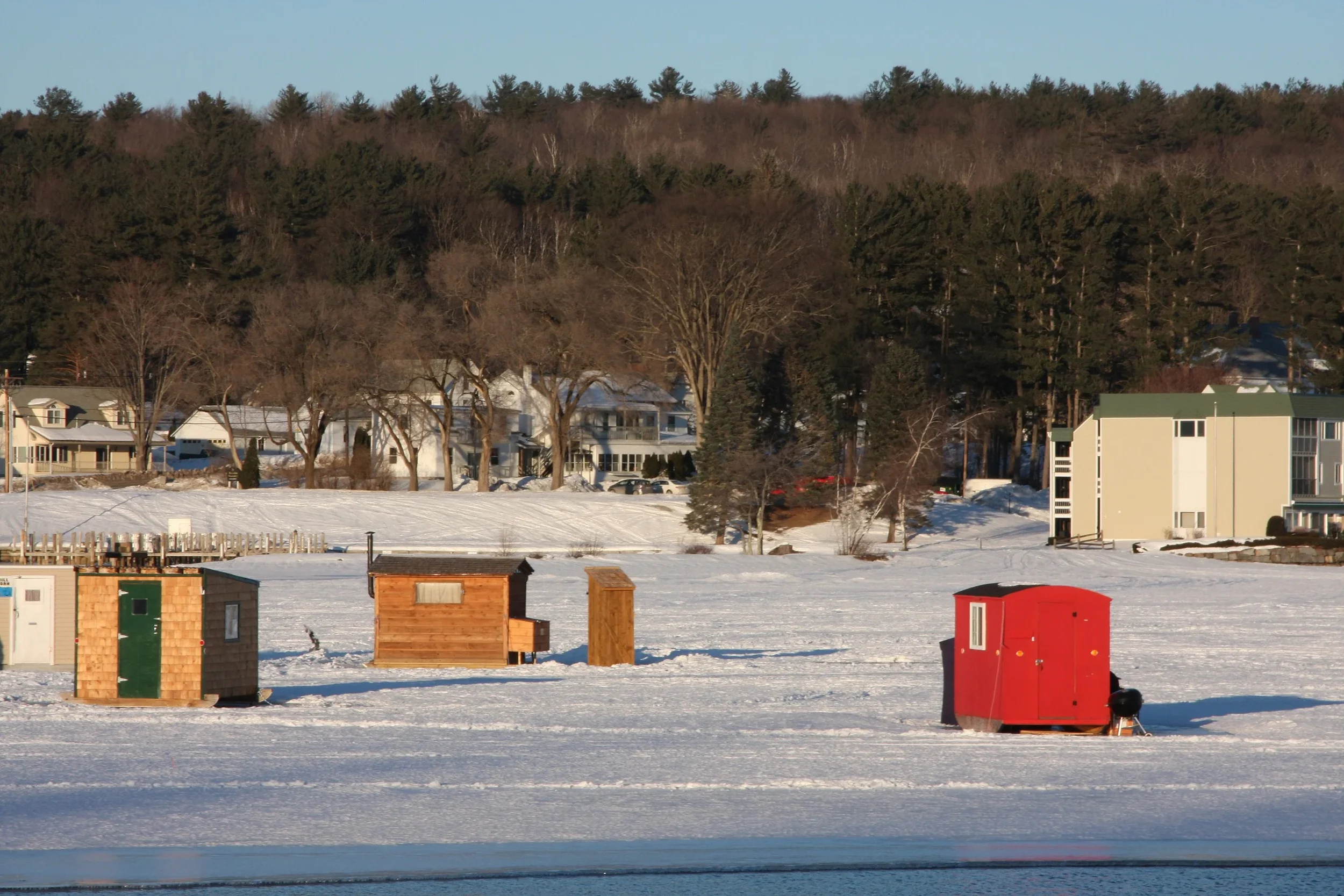 Ice fishing in Merideth NH, a town Taylor Tree Service Serves.