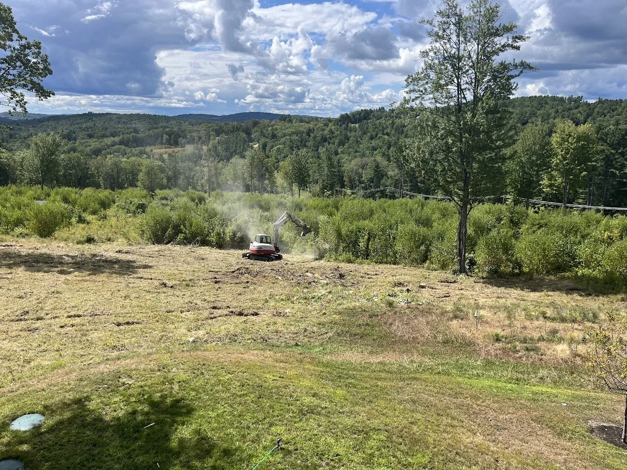 Taylor Tree Service mulching an overgrown field in Nottingham New Hampshire.
