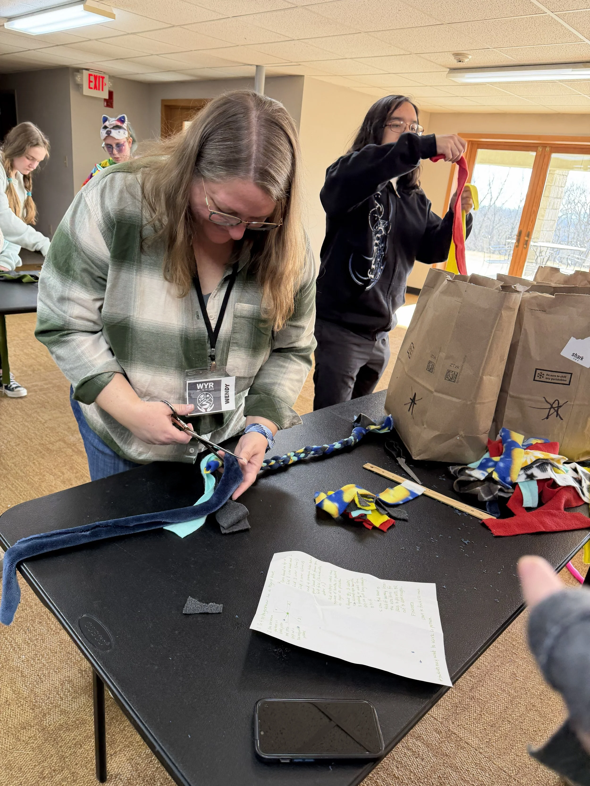 Wendy, chaperone extraordinaire, helping with our service project for Winter Youth Retreat 2026