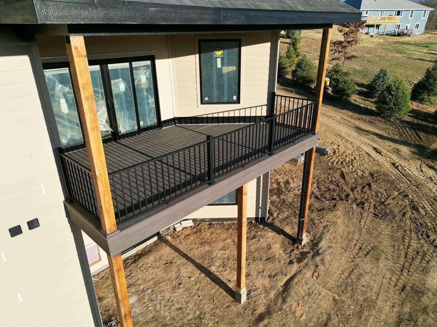 Custom deck for Blum Brothers. The customer wanted a #drainage system and a finished cedar ceiling. #Azek dark hickory decking with #Westbury railings. @azekbuildingproducts @diggerspecialtiesinc @kylergifford @timbertech #customdecks #iowa #huskerde